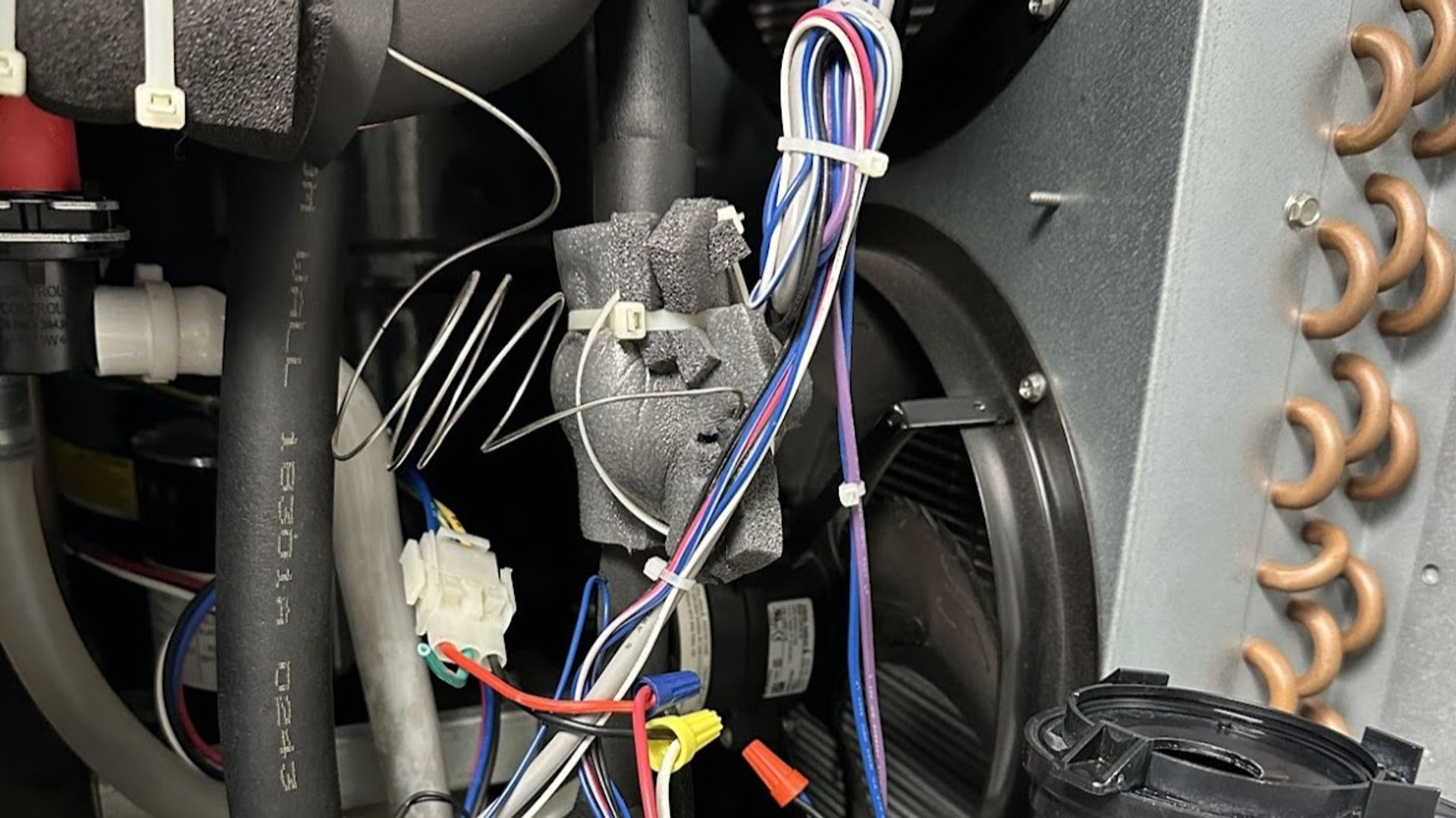 Art HVAC Technician Servicing a Refrigerated Grab and Go Display Case at a NYC Convenience Store Commercial Site