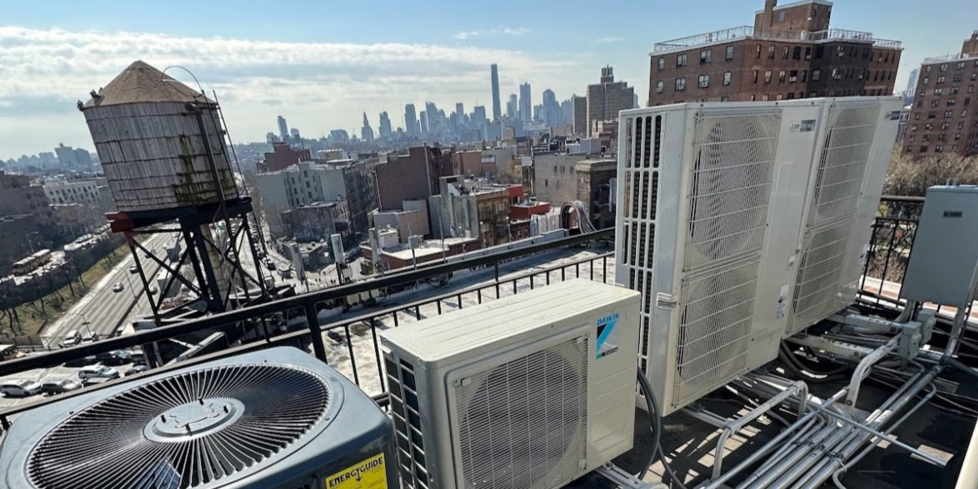 HVAC rooftop units with NYC skyline