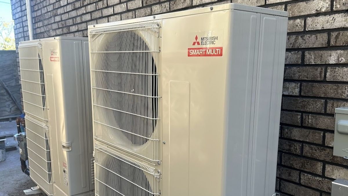Art HVAC Technician Installing a Commercial Dehumidifier in a NYC Office During a Humidity and Indoor Air Comfort Job