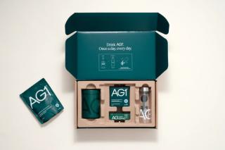 Welcome kit for new subscribers. AG1 pouch, bottle, container, scoop and travel packs.