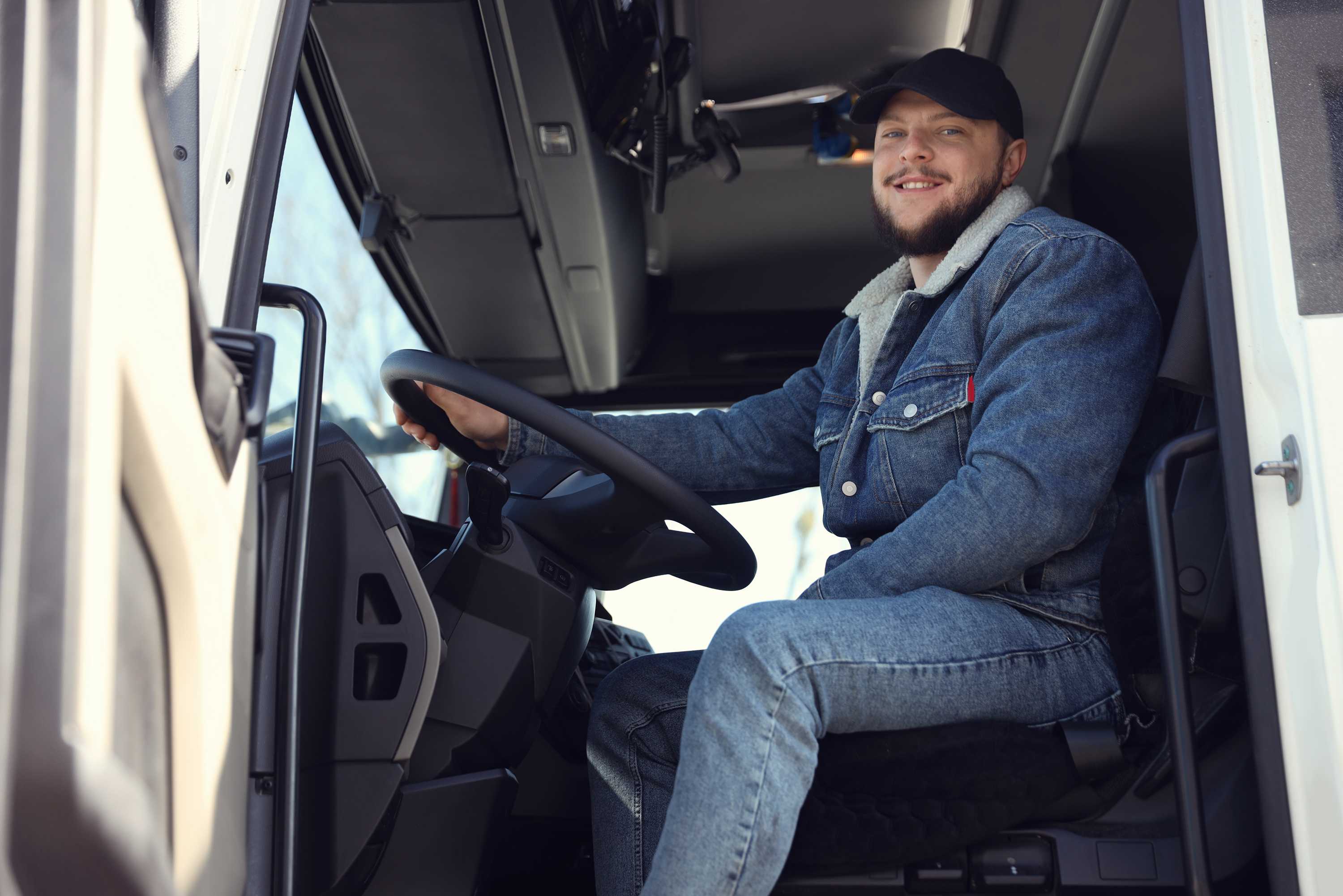 Professional courier driver with a Fast Freight Forward vehicle