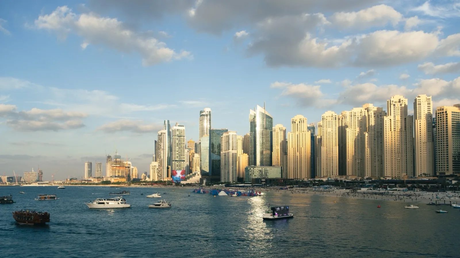 Dubai Marina and JBR residential apartment towers at sunset, illustrating Dubai property service charges and building ownership