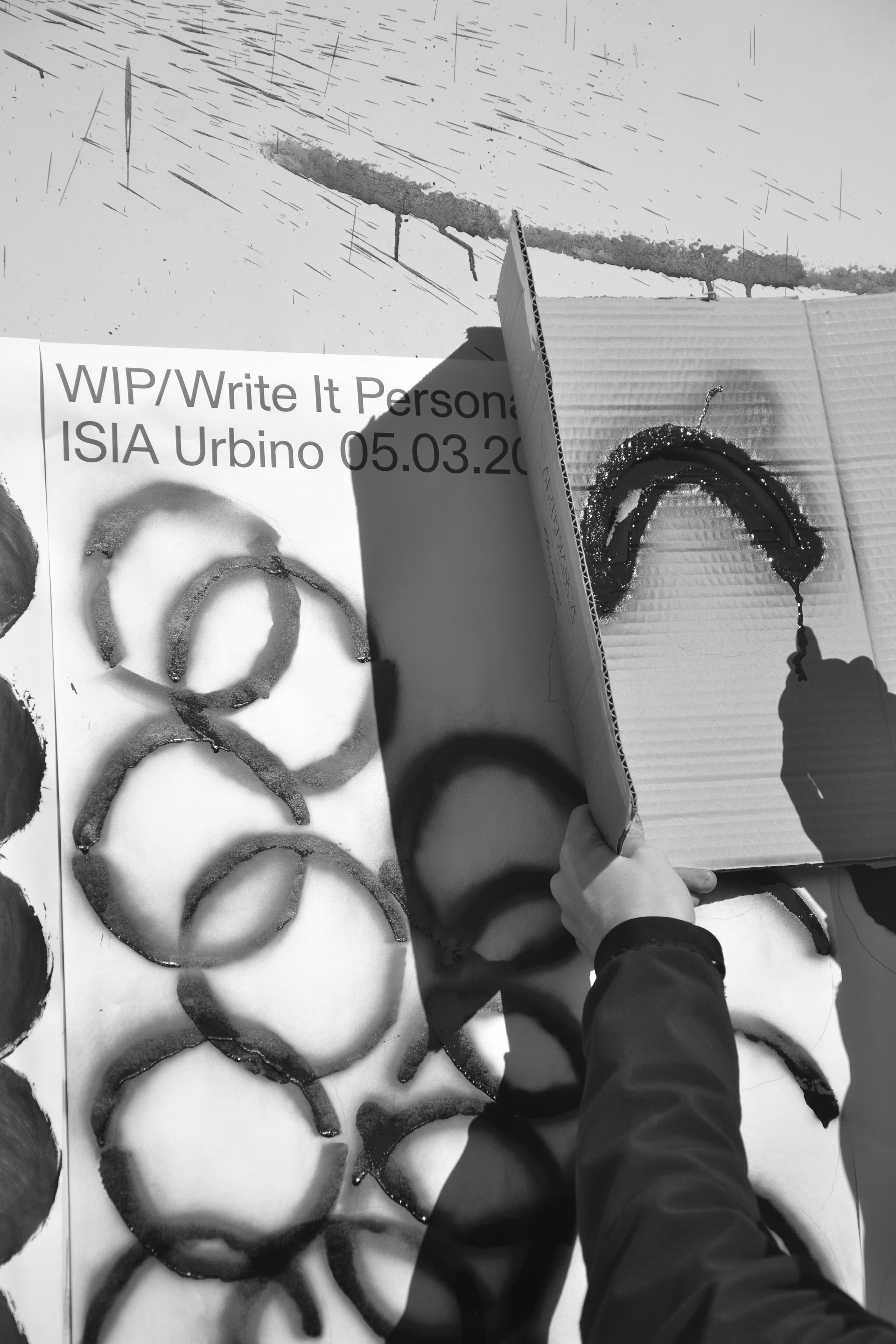 Black-and-white close-up of a Write It Personal print with circular black forms.