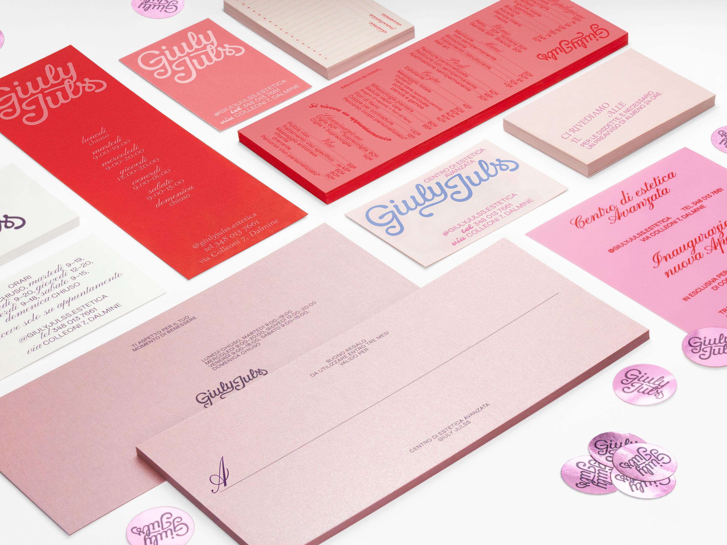 Pink Giuly Julss cards, labels and stationery arranged on a pale pink surface.