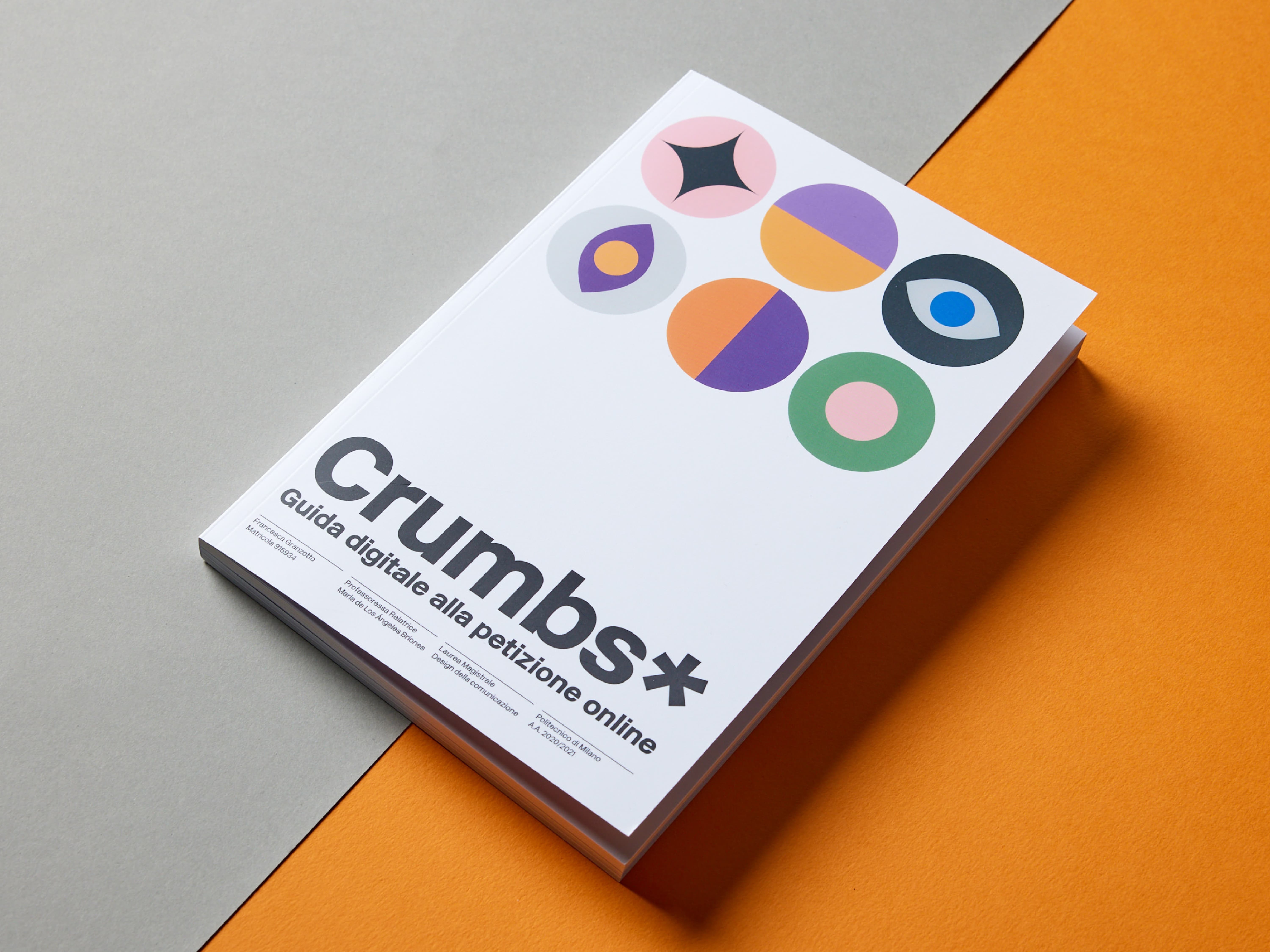 White Crumbs* guide with coloured circles on an orange surface.