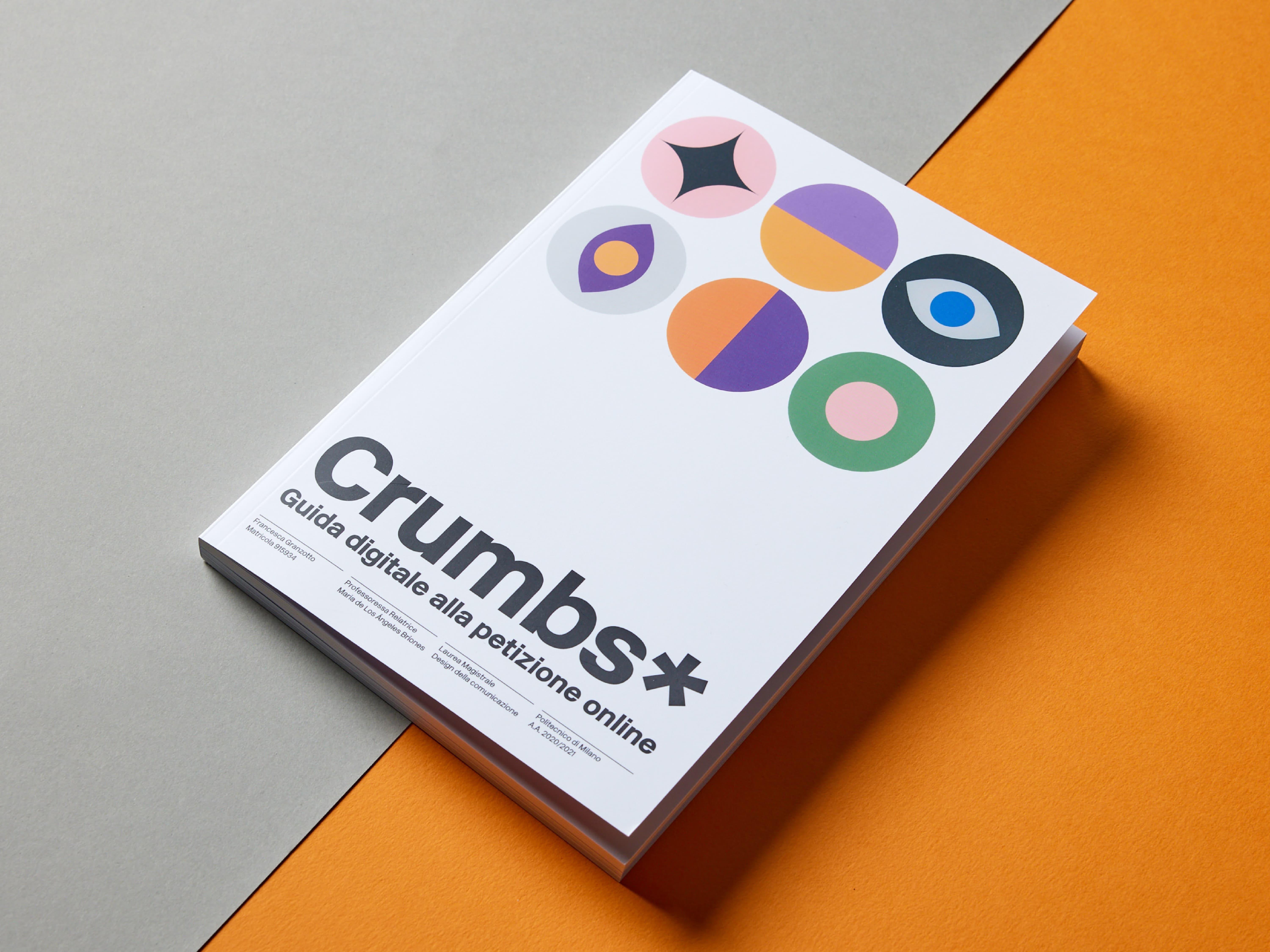 White Crumbs* guide with coloured circles on an orange surface.