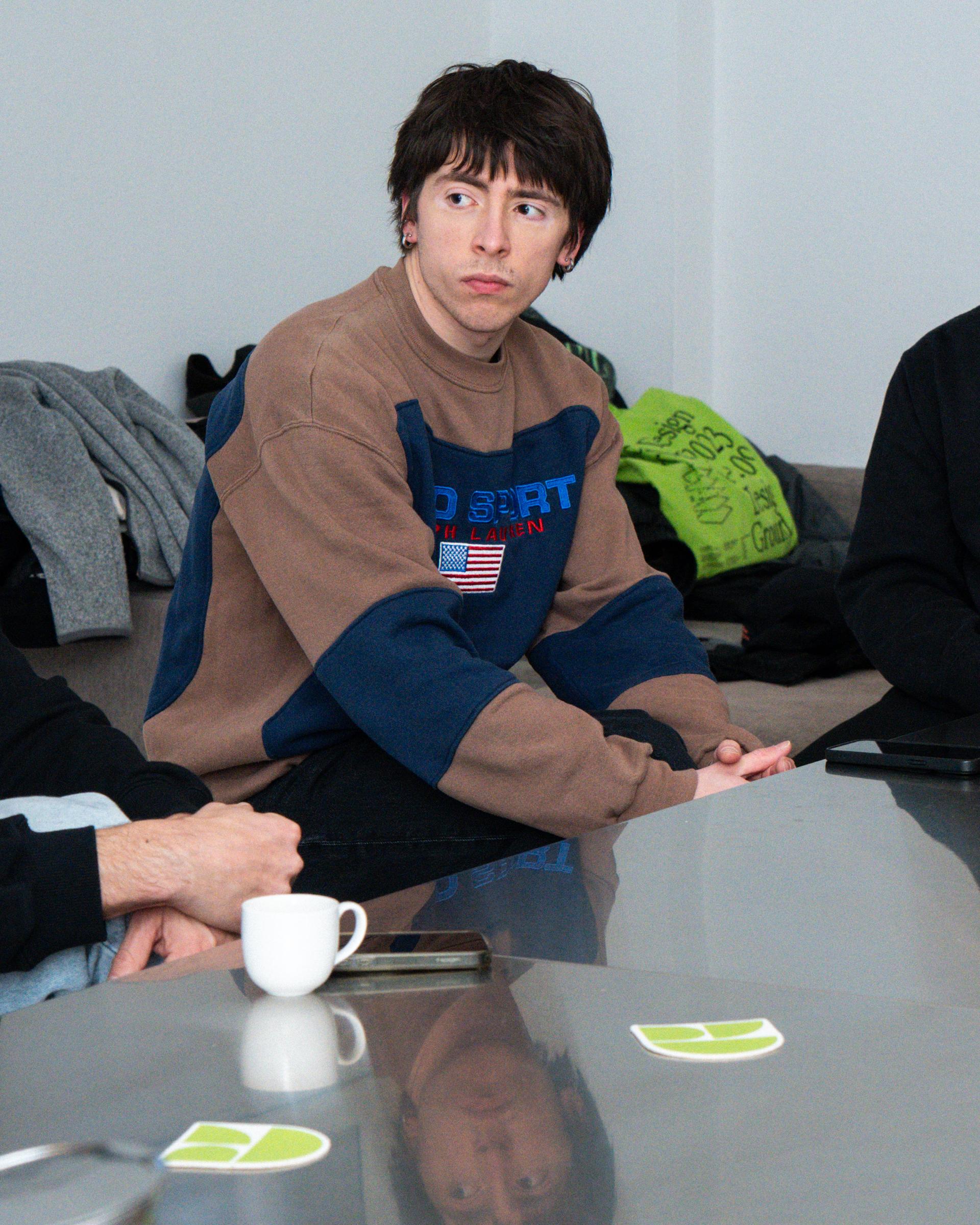 Attendee seated at a table during the 5+1 visit at Giga.