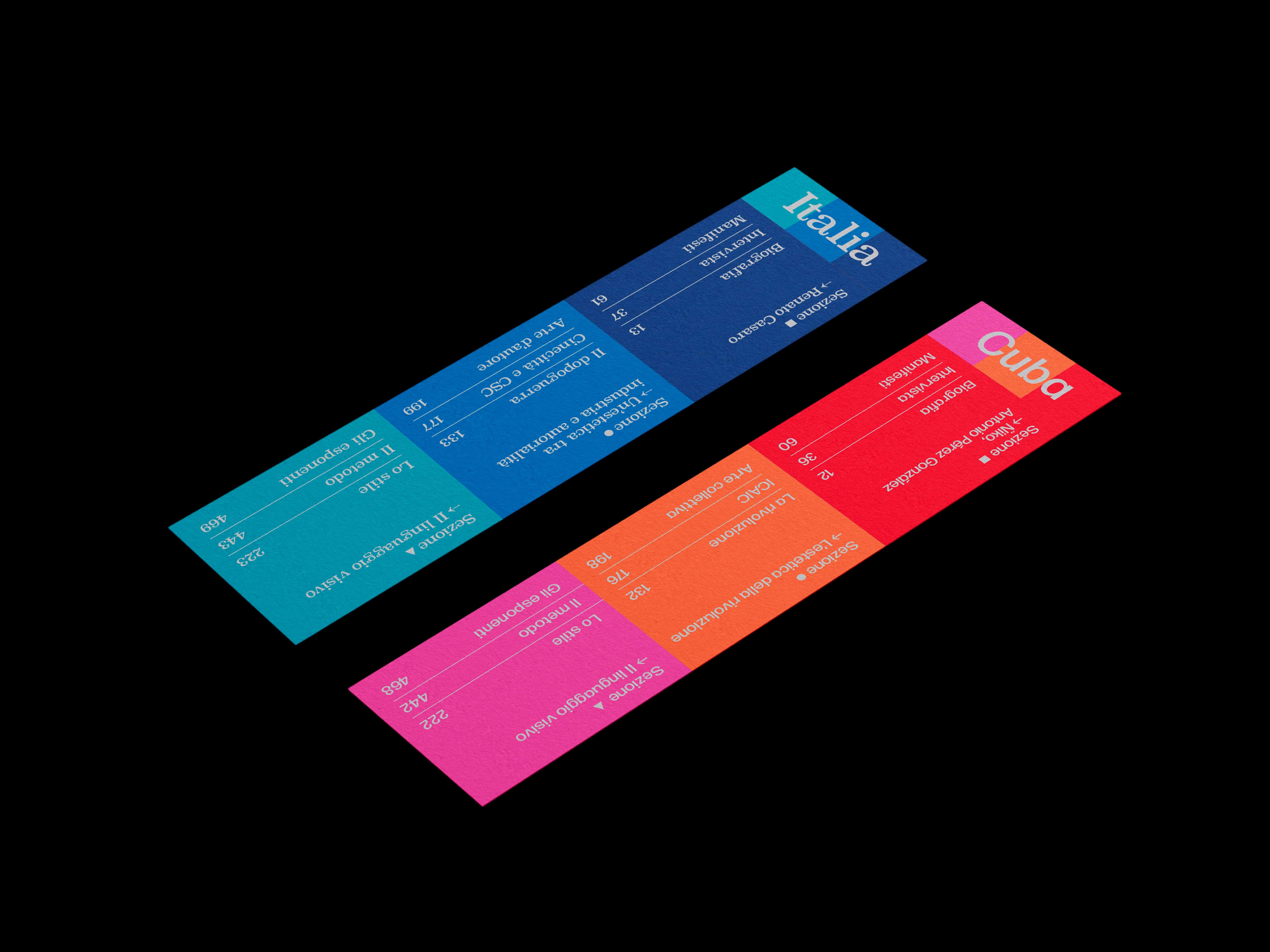 Two colour-coded bookmarks labelled Italia and Cuba, one blue and turquoise, the other orange and magenta, on black.