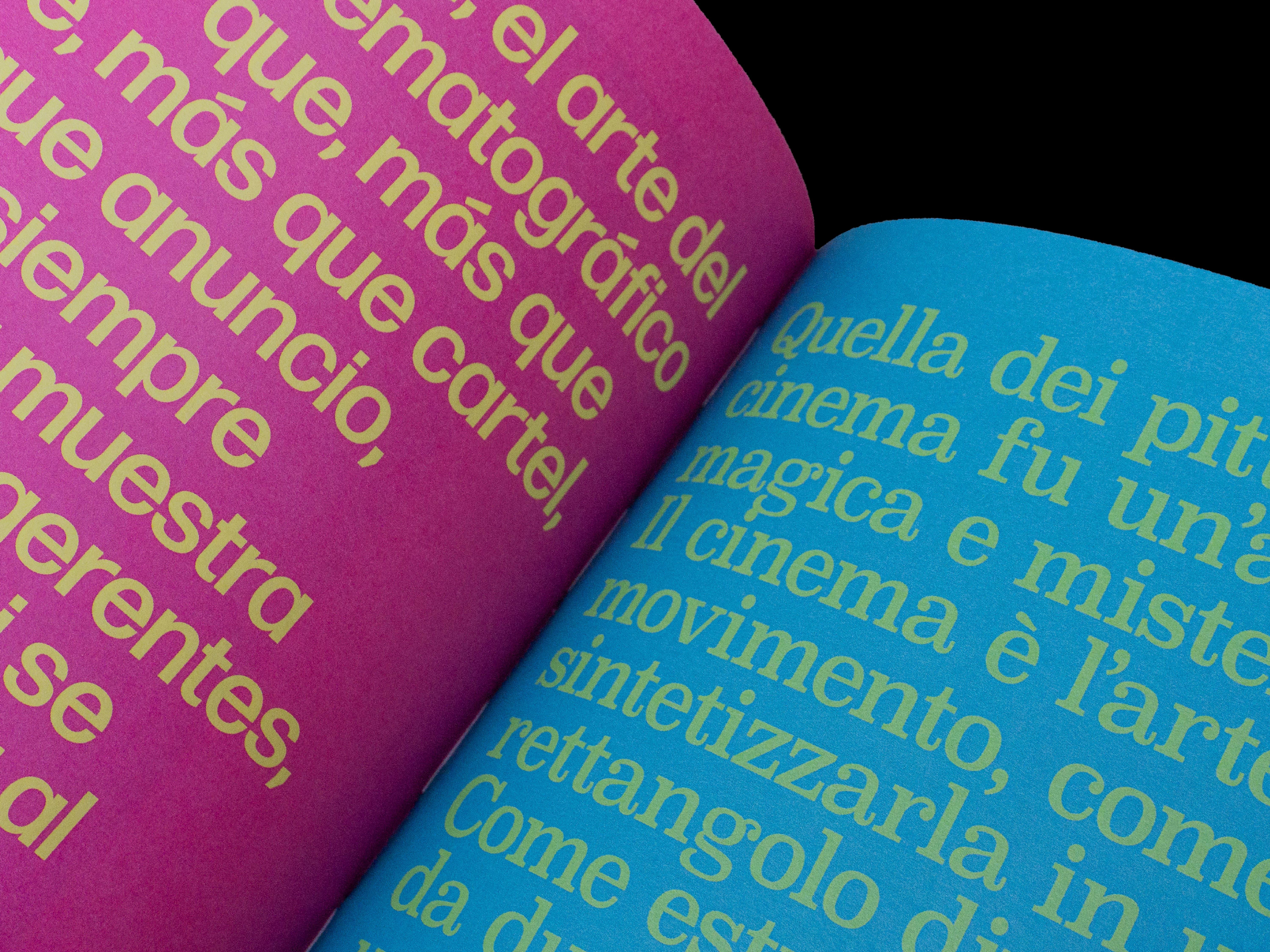 Close-up of quotation pages printed in yellow on magenta in Spanish and in green on blue in Italian.