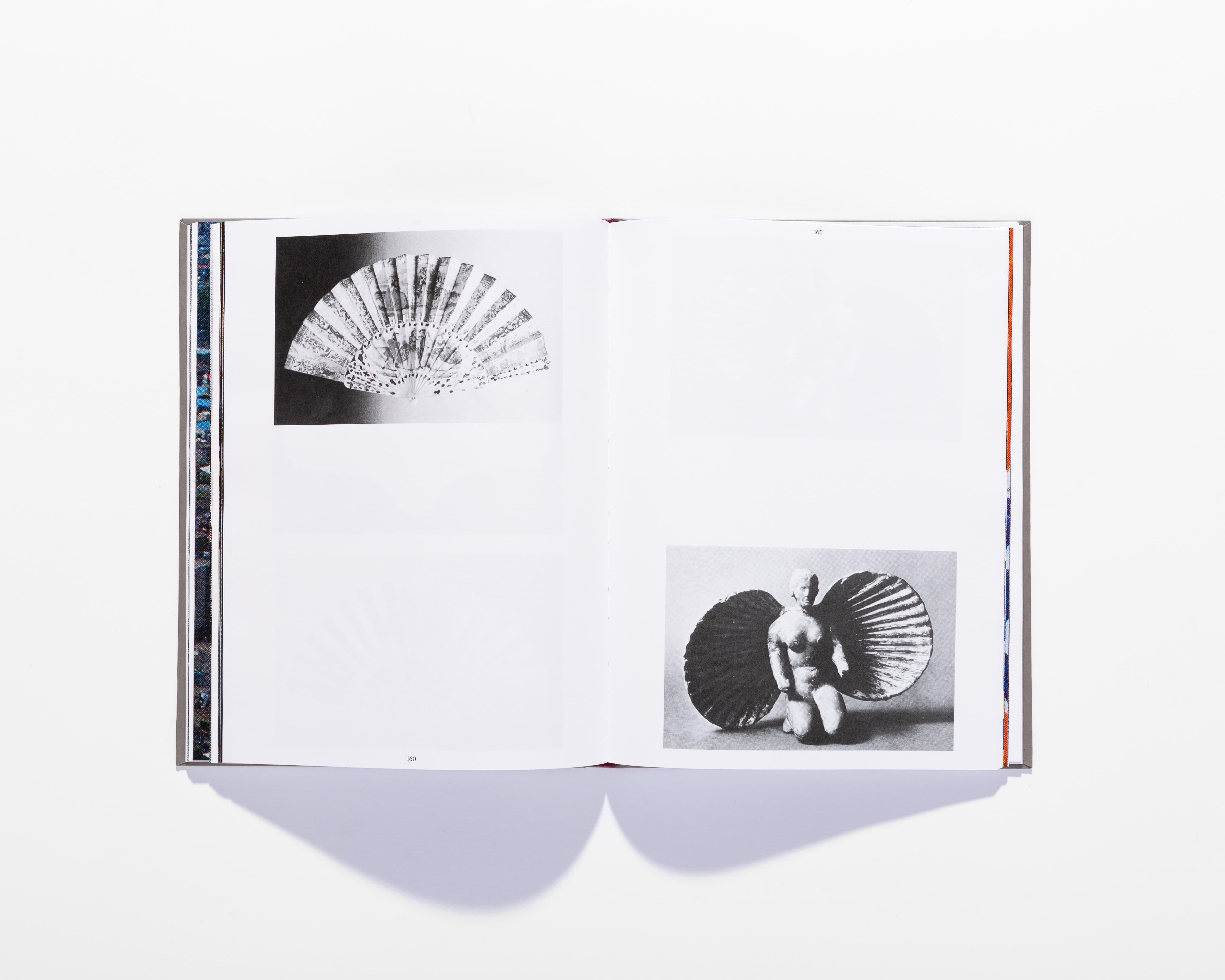 Open Il Crampo di Gesso book showing a black-and-white folding fan and a seated figure.