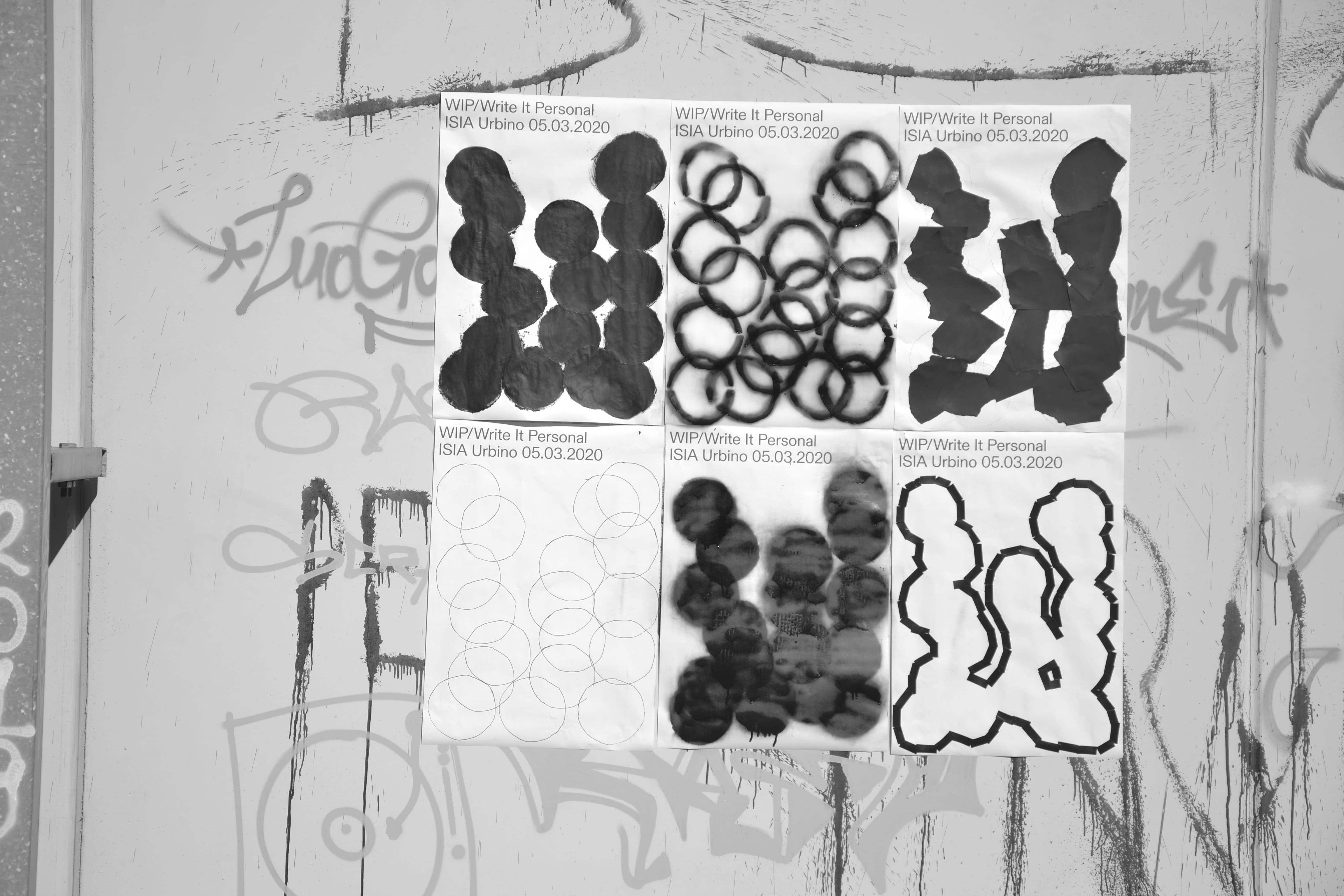 Six black-and-white Write It Personal posters pinned to a graffiti-covered wall.