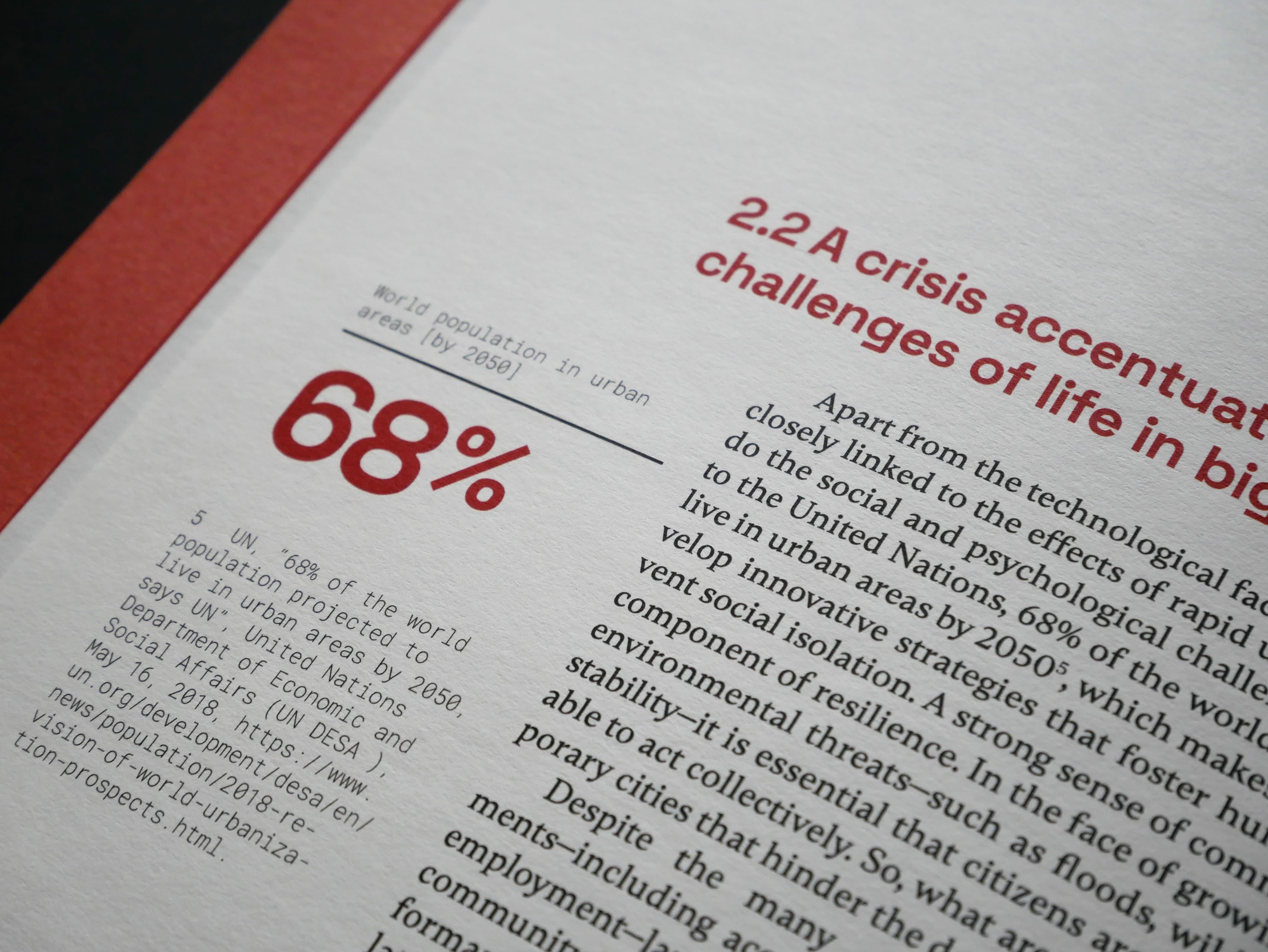Close-up of a thesis page titled "A crisis accentuates challenges of life in big cities."