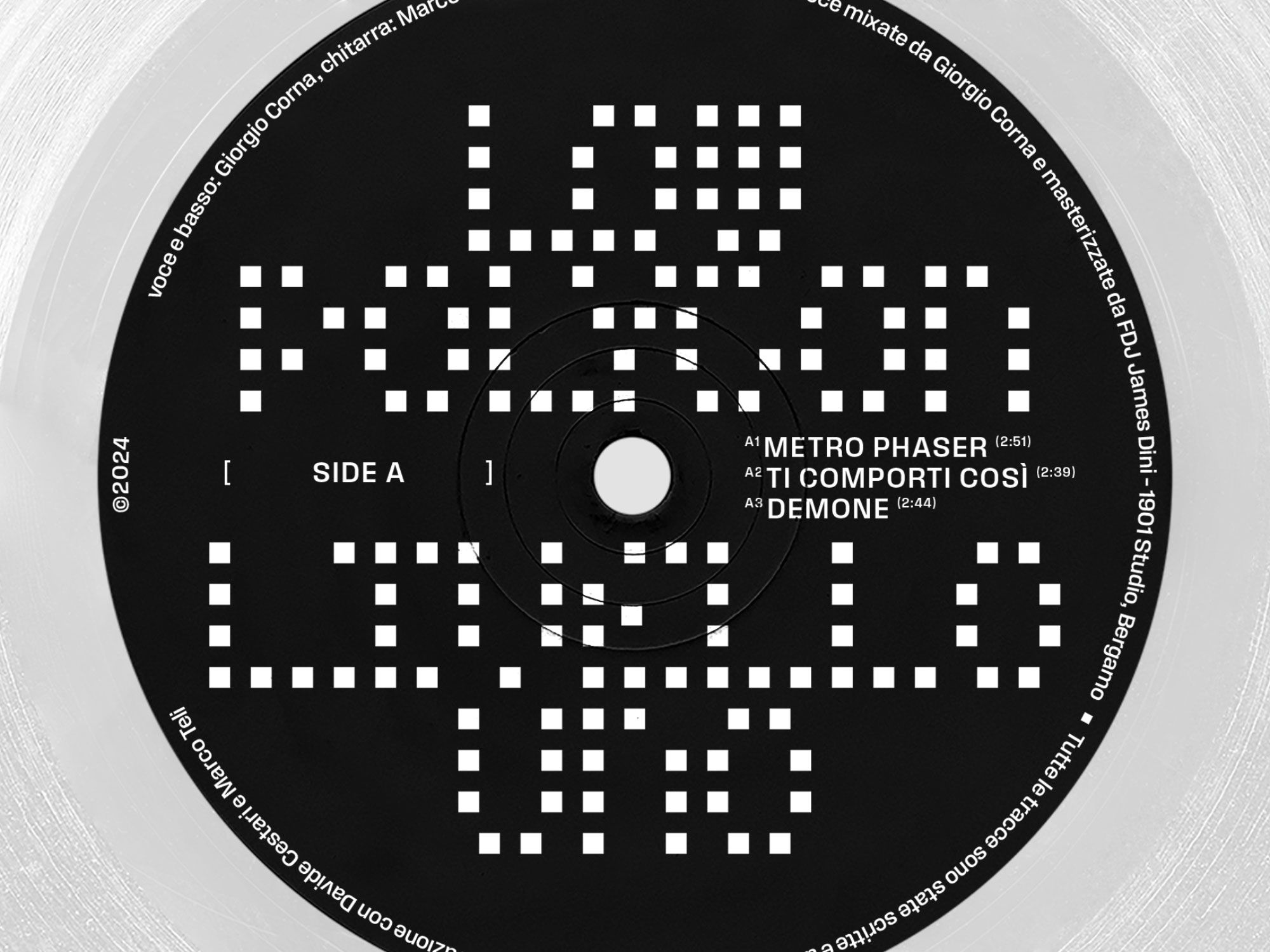 Black record labelled Metro Phaser with a white pixelated pattern.