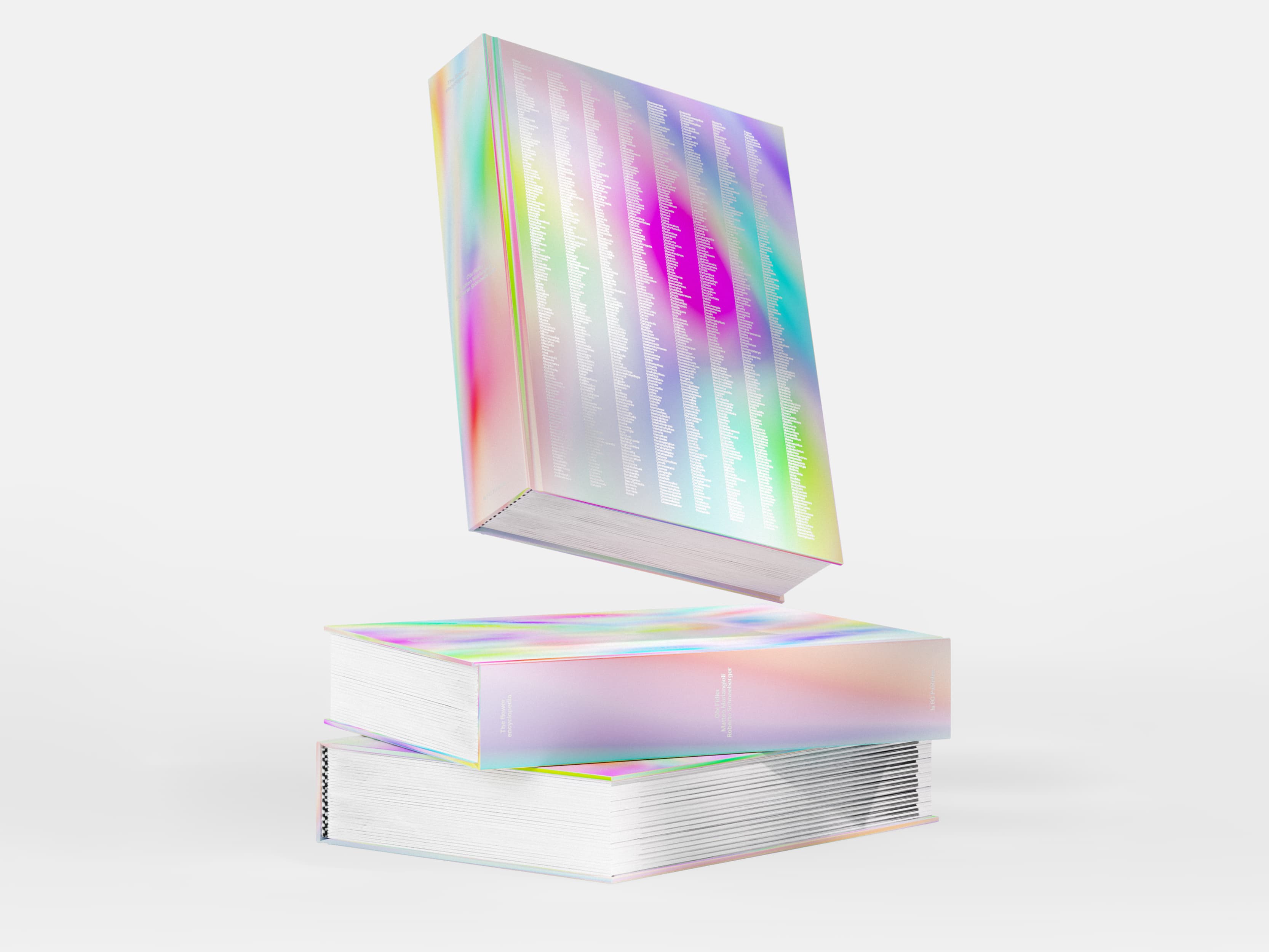 Rainbow-reflective Flower Encyclopedia books stacked on a white background.