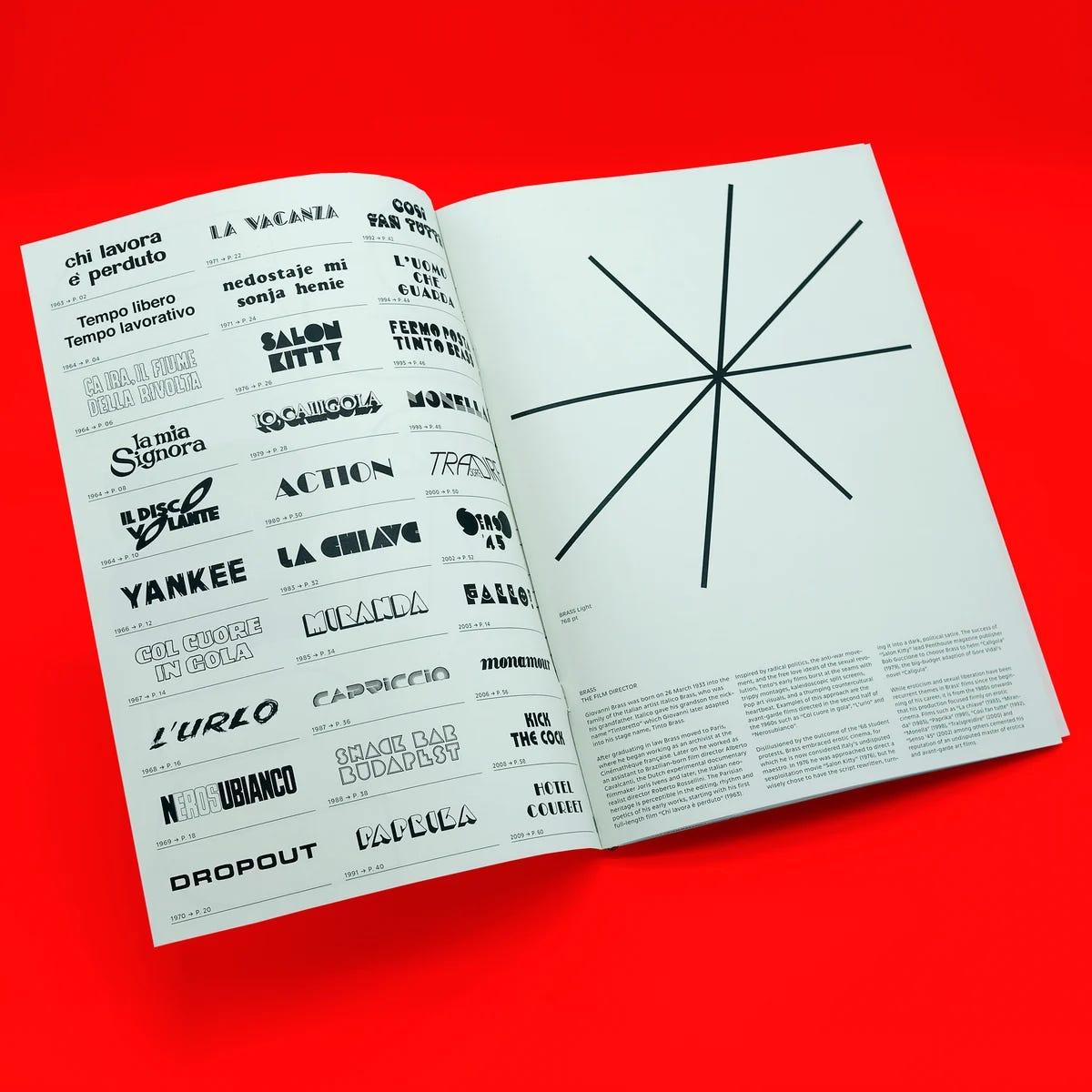 Open type specimen book on a red surface, showing small display letterforms and a black radial graphic.