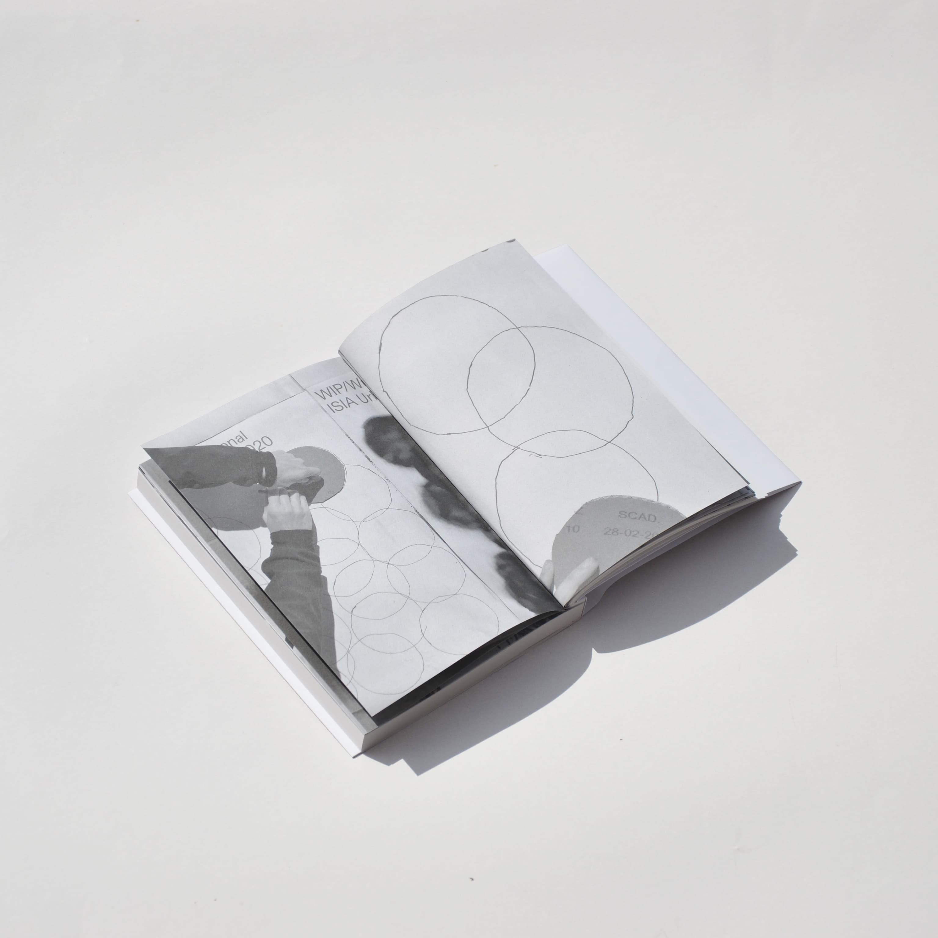 Open Write It Personal book with abstract grey illustrations.