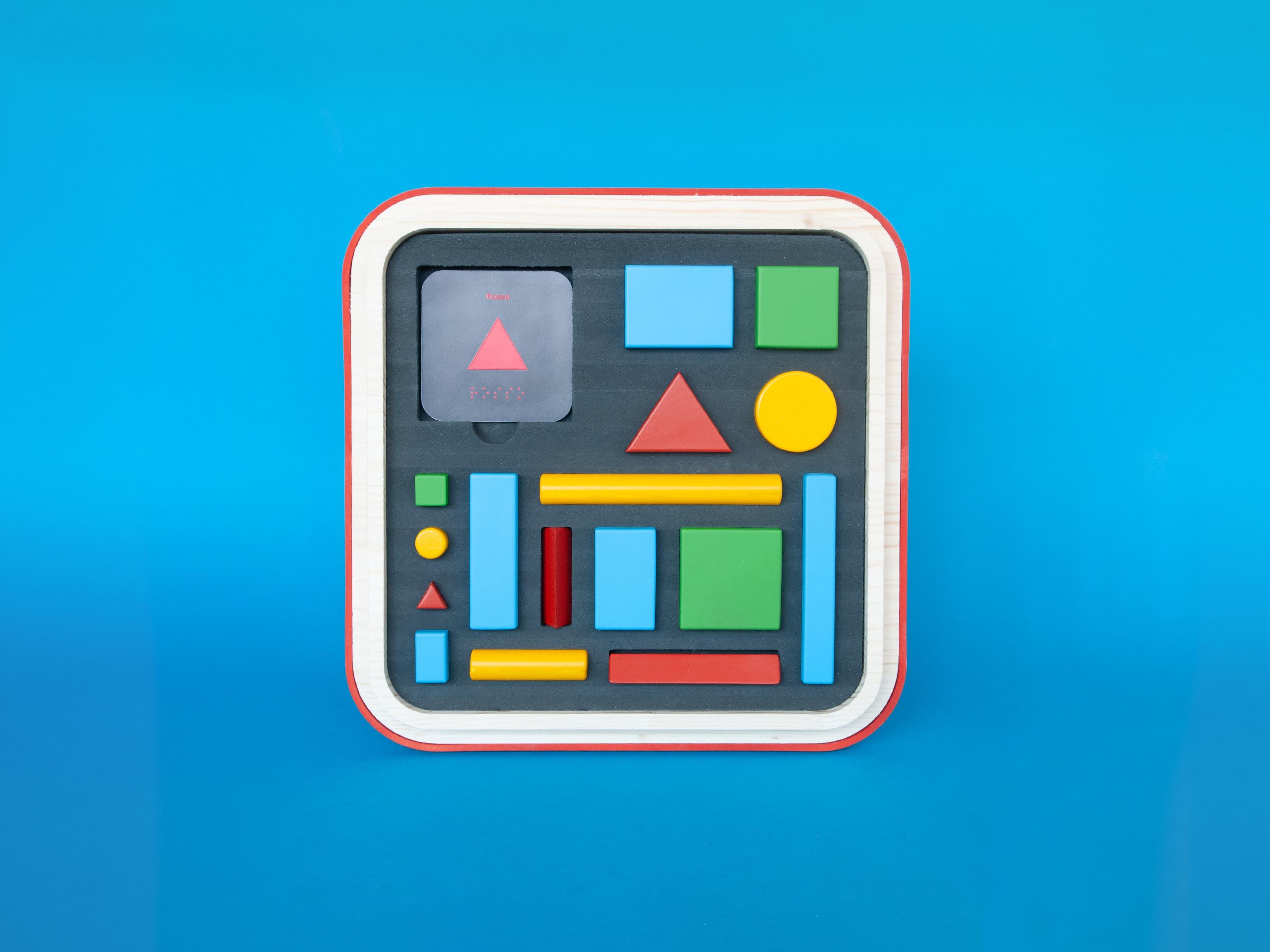 Graphic of a grey control panel with coloured buttons on blue.