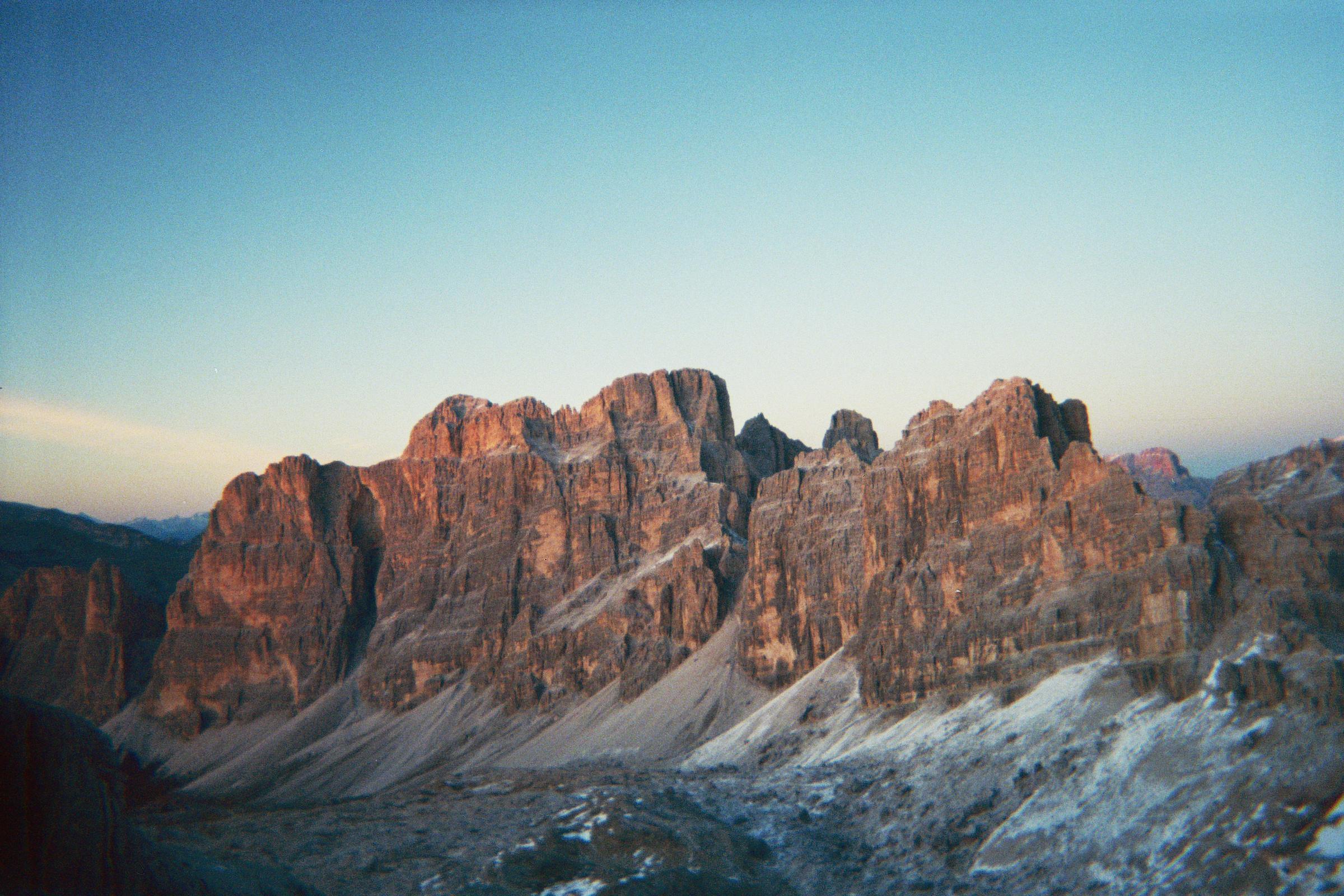Dolomite peaks seen from Lagazuoi EXPO Dolomiti at dusk.