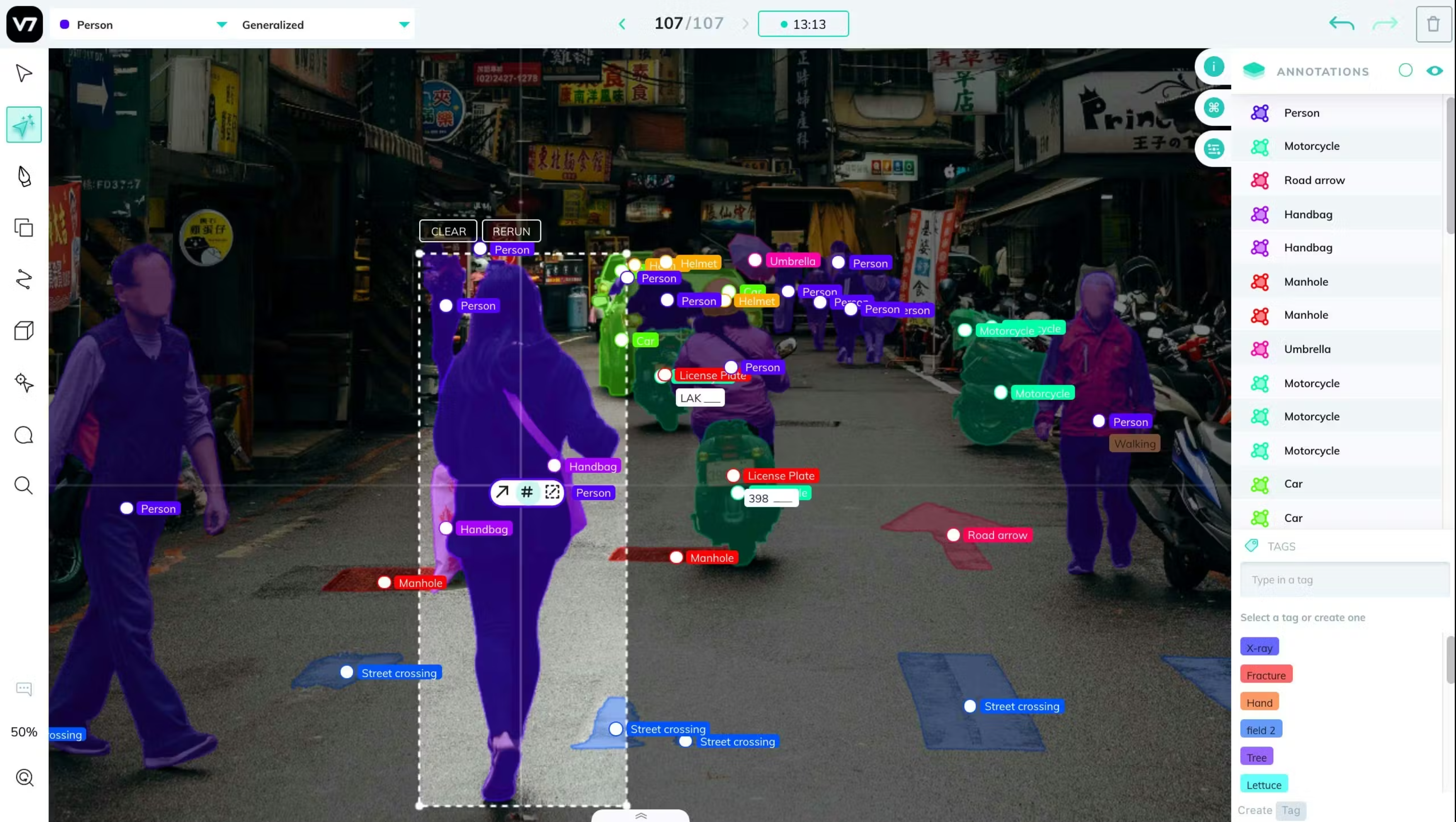 V7 annotation interface with a street scene divided into coloured segmentation masks and labelled objects.