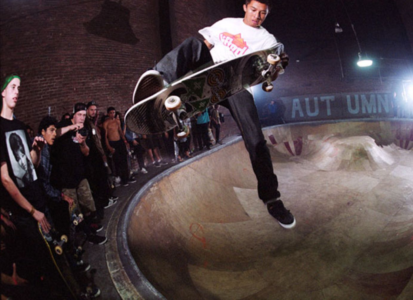 A skateboarder in the air performing a grab trick