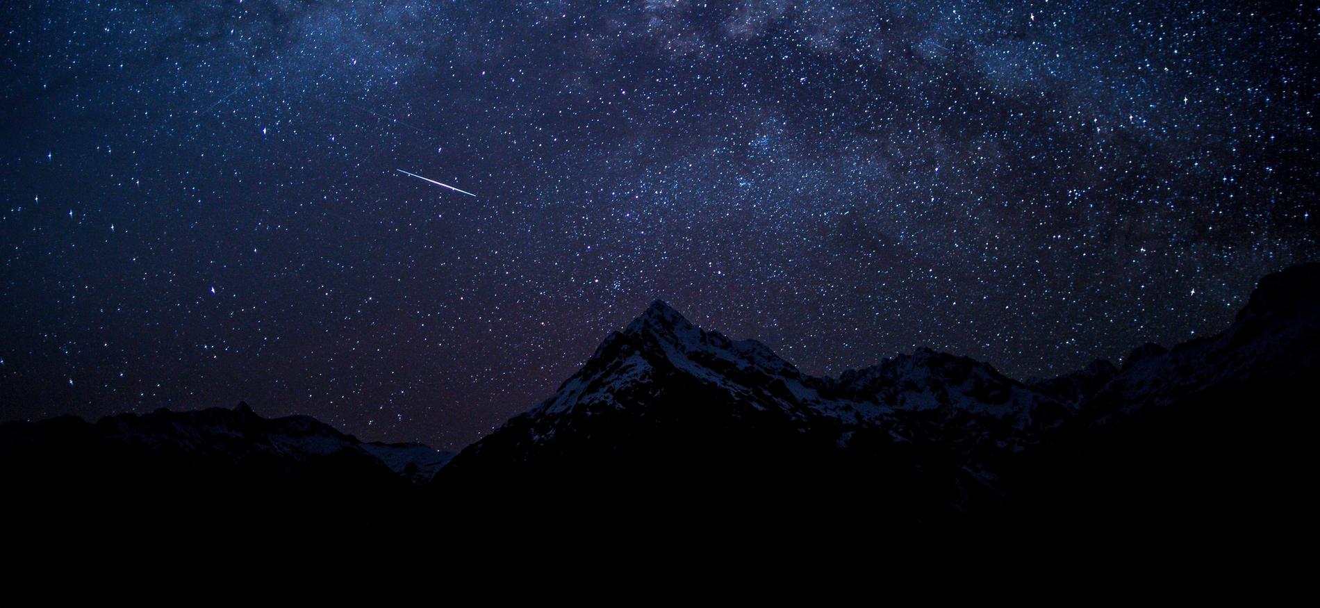 A stack of gold bars in a black background