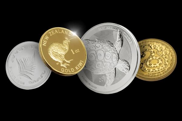 4 coins, a mix of gold and silver, with different patterns on them