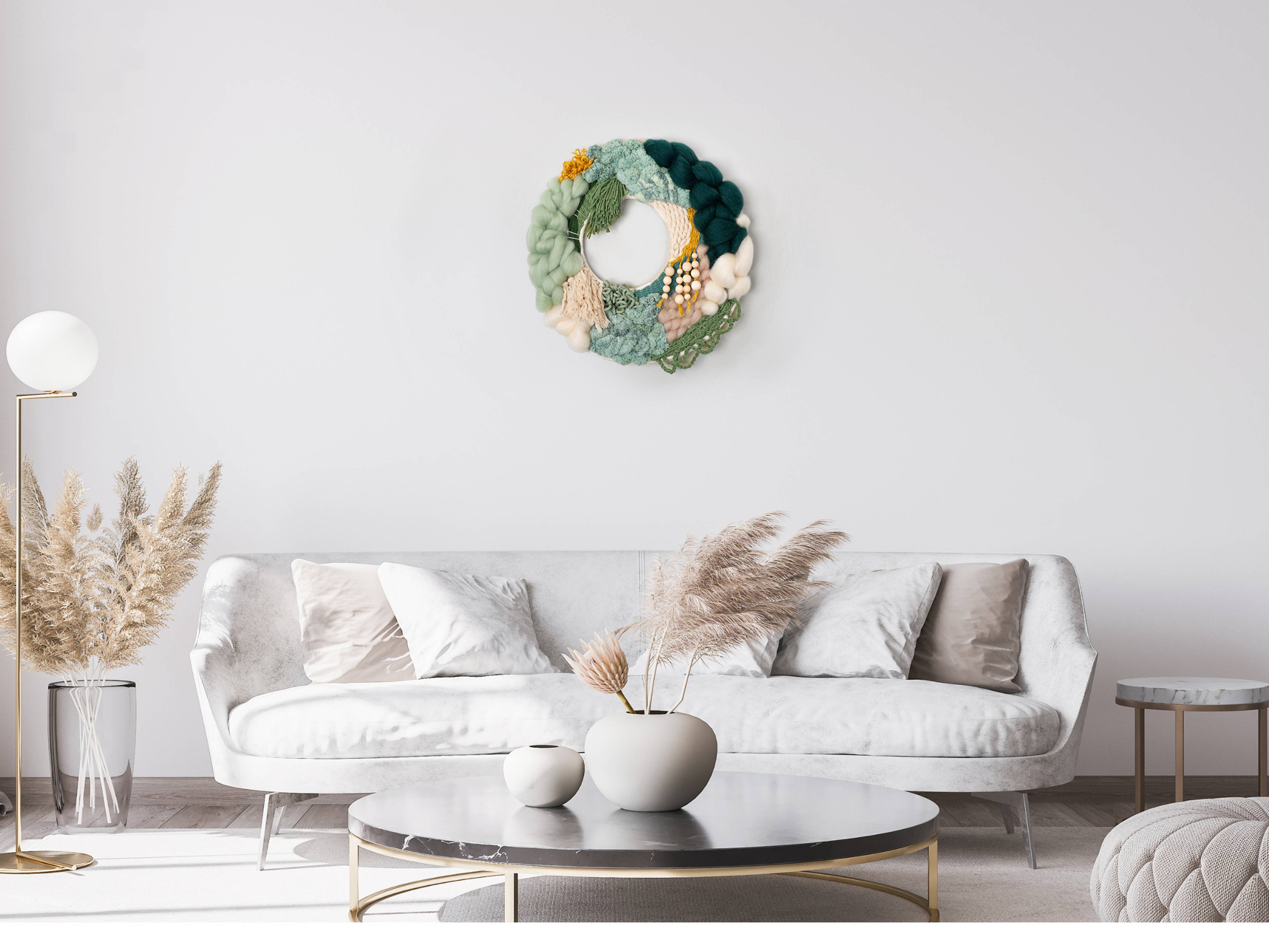 Woven wreath hanging above a sofa