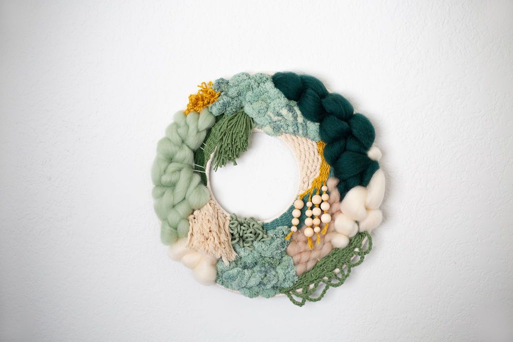 Round fiber wreath in sage, deep green and cream with beaded accents