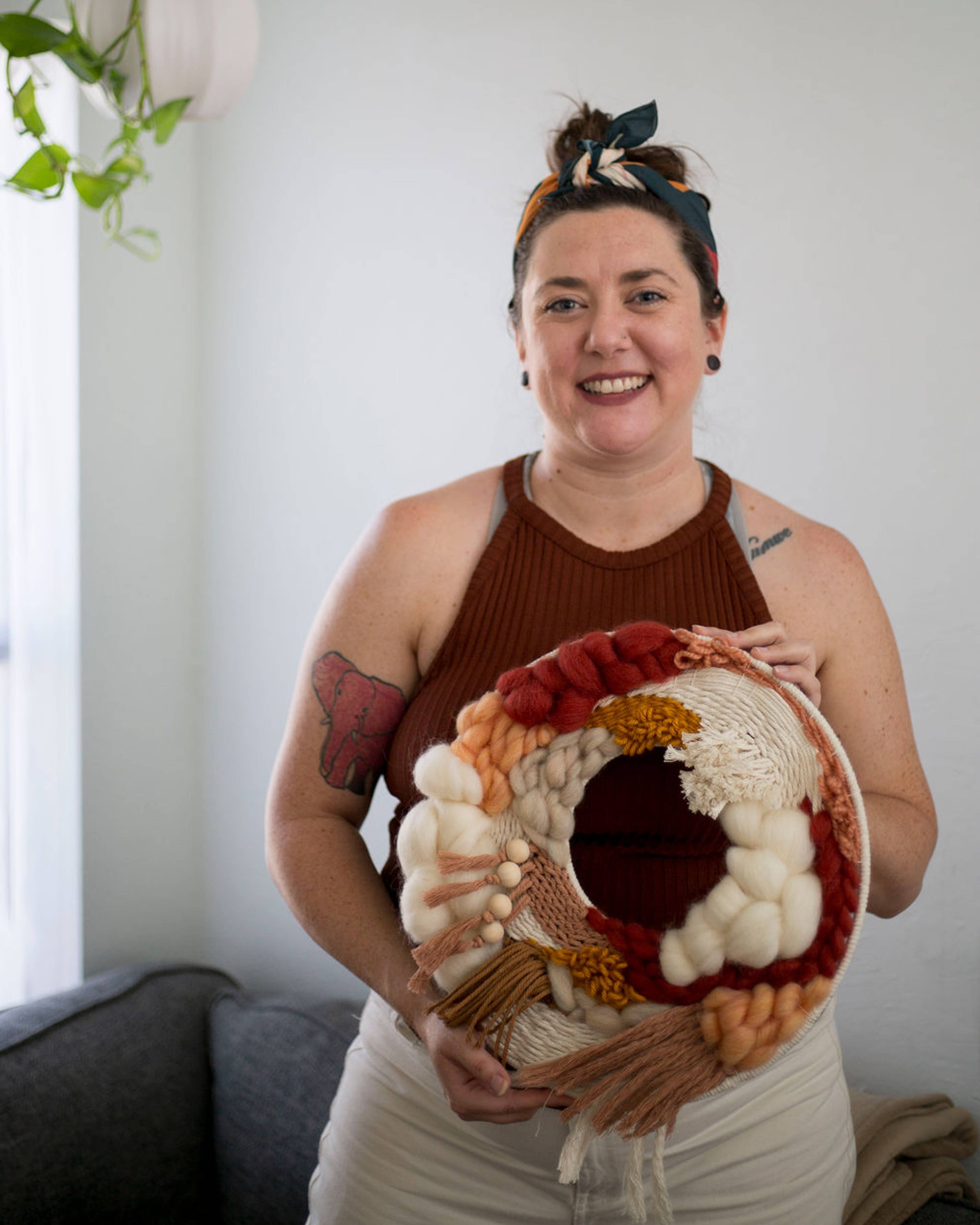 Rachel holding a finished wreath