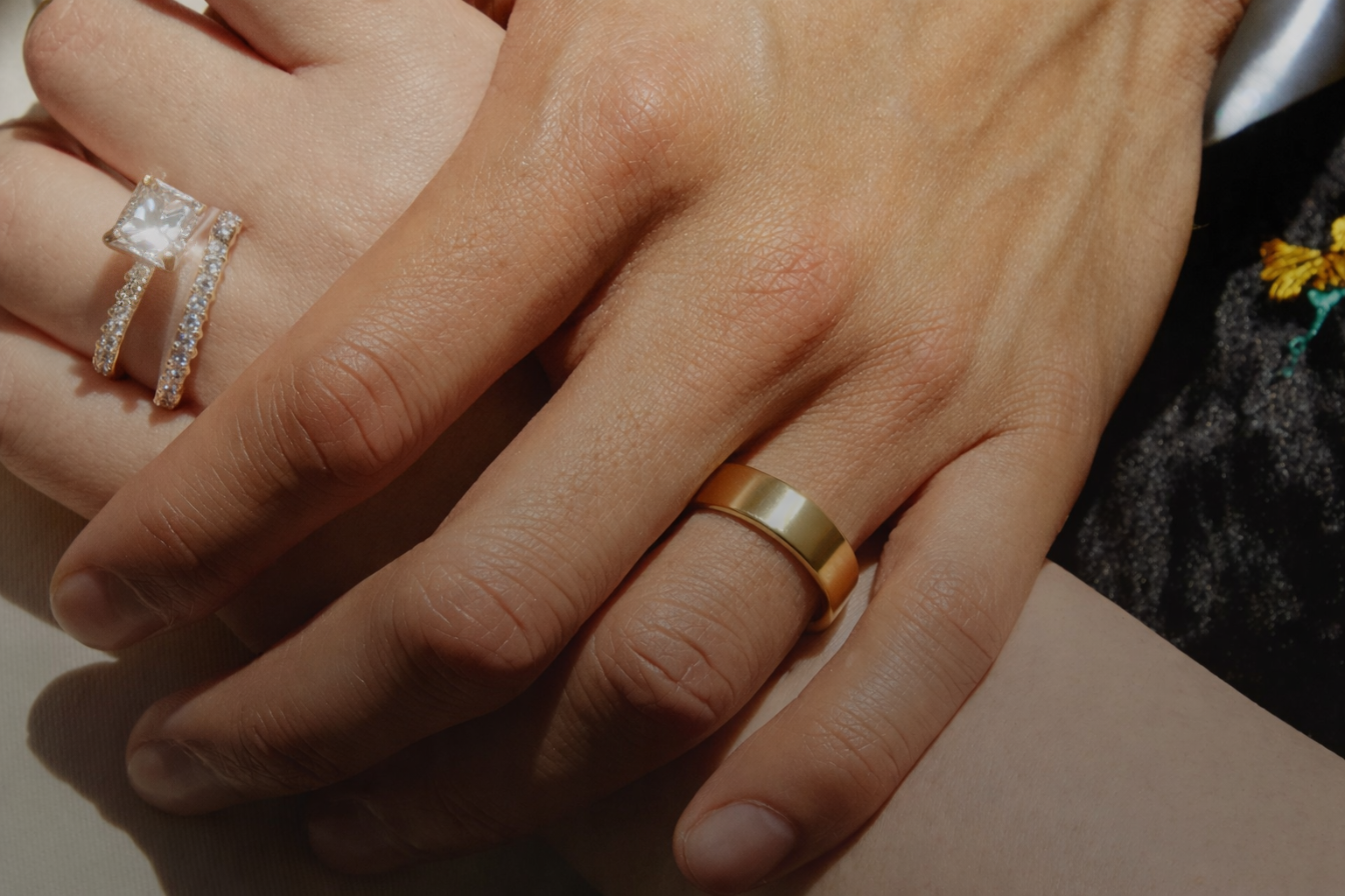Bride and groom holding hands on wedding day.