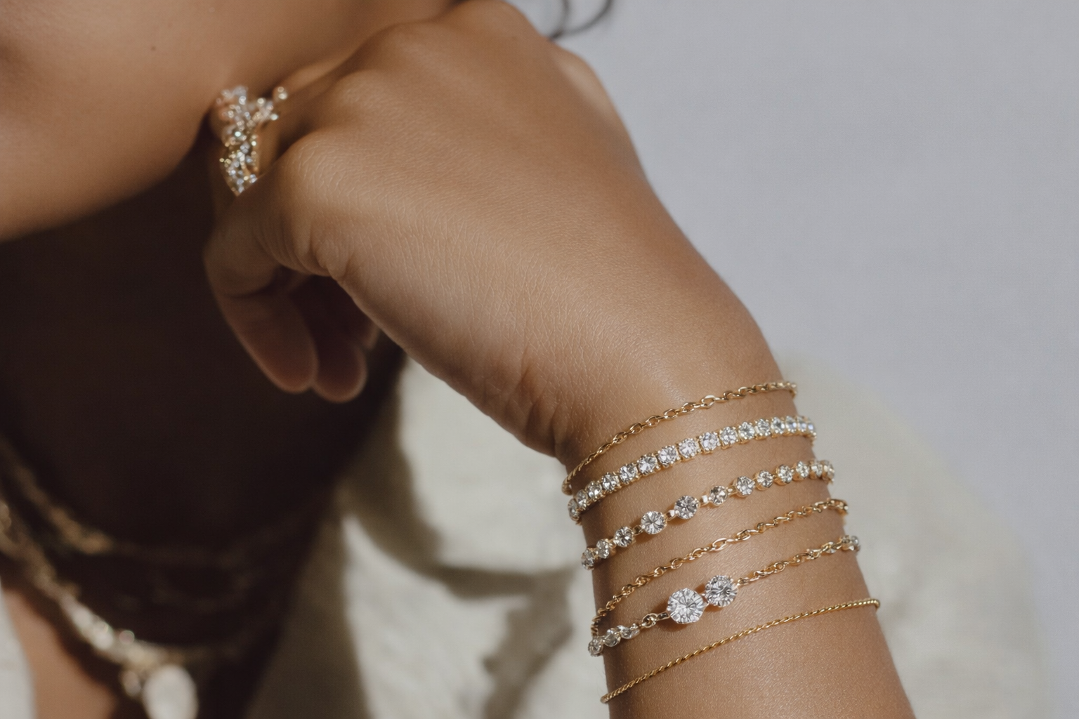 Woman posing with her rings and bracelets visible