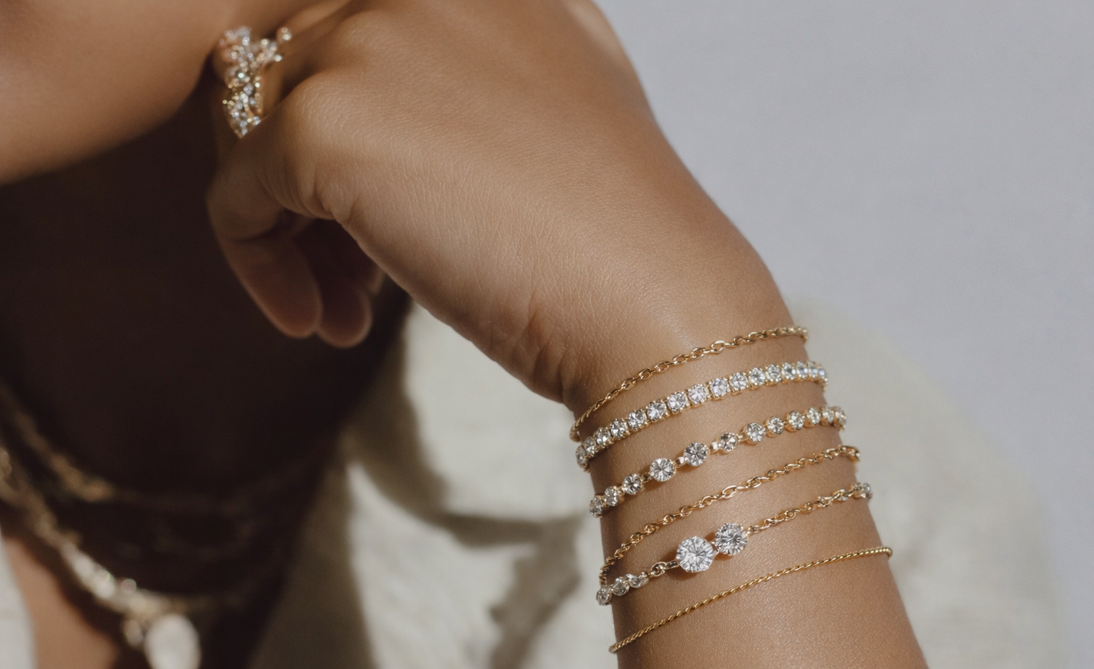 Woman posing with her rings and bracelets visible