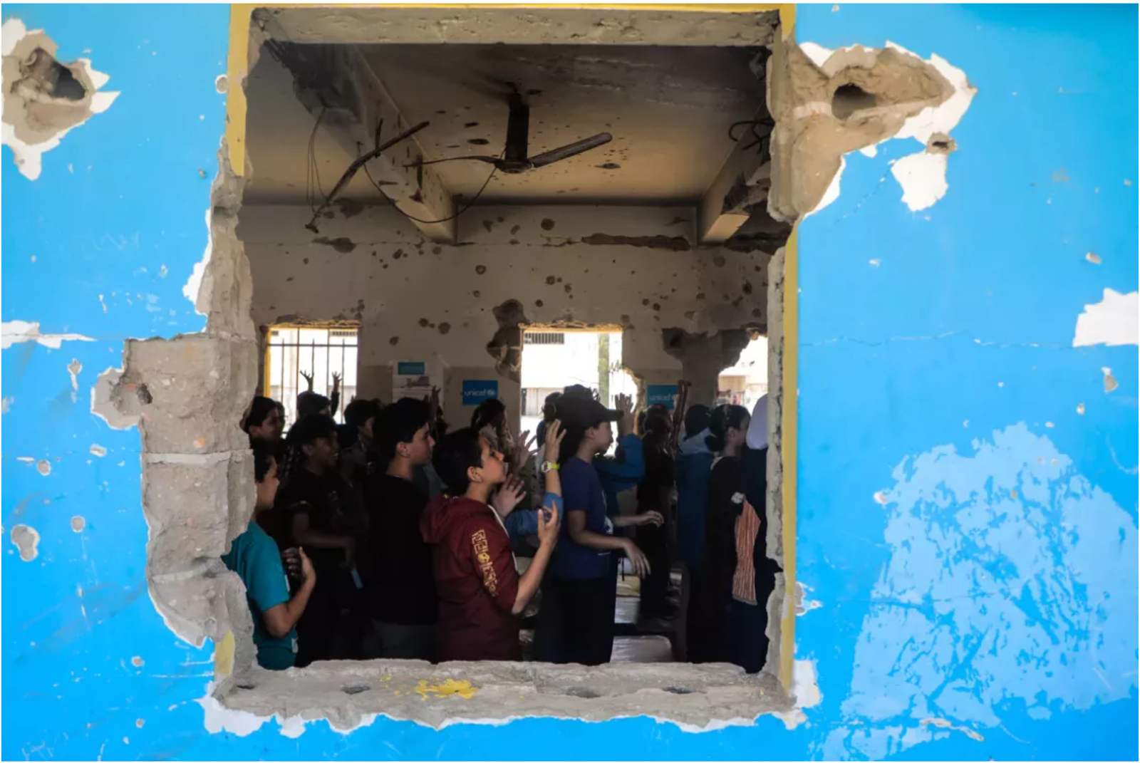 UNICEF/UNI807643/Nateel: Children learn how to identify and protect themselves from hidden explosives in a UNICEF-supported class