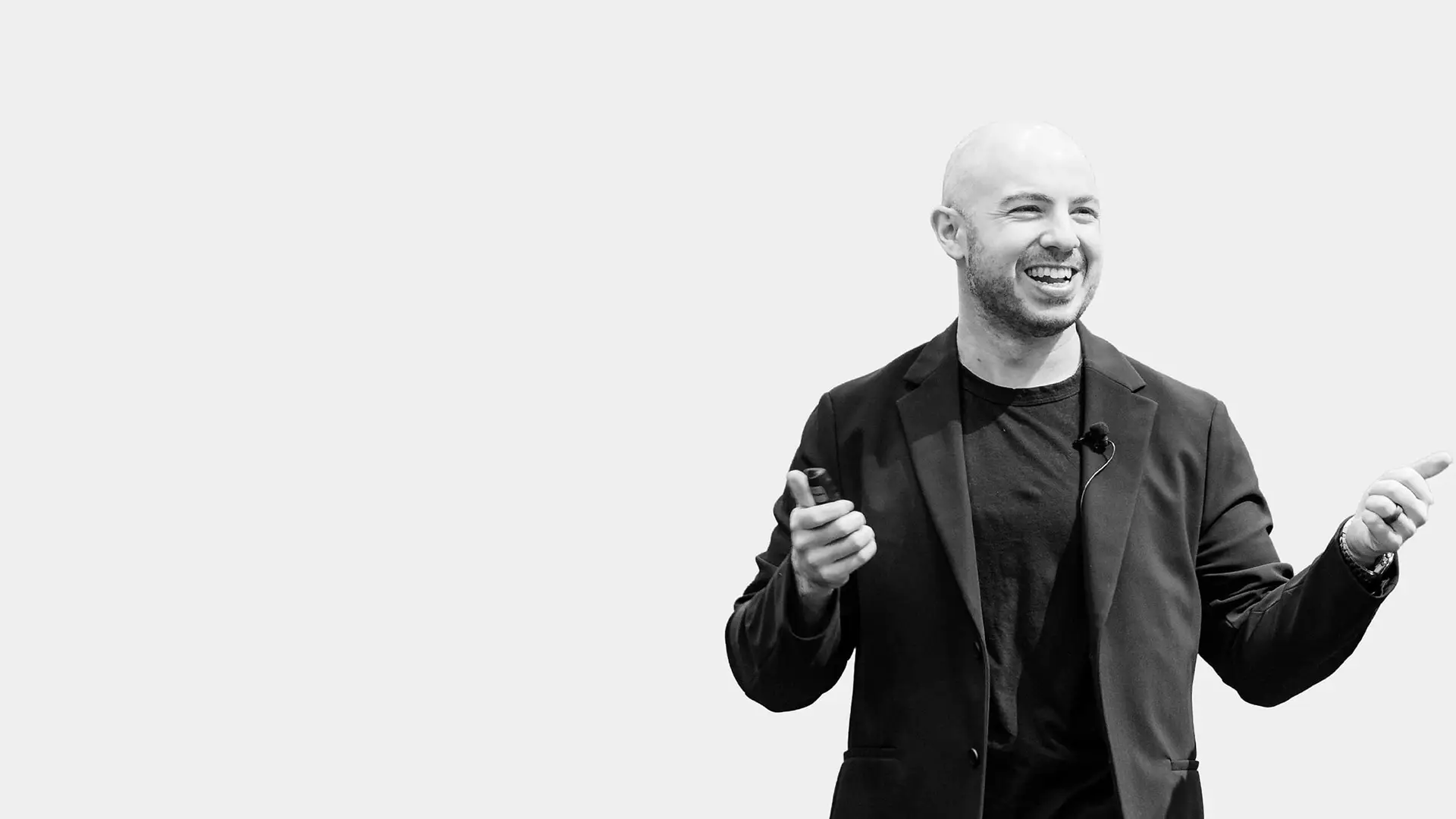 Danny Goldberg speaking on stage, mid-gesture, against a light backdrop