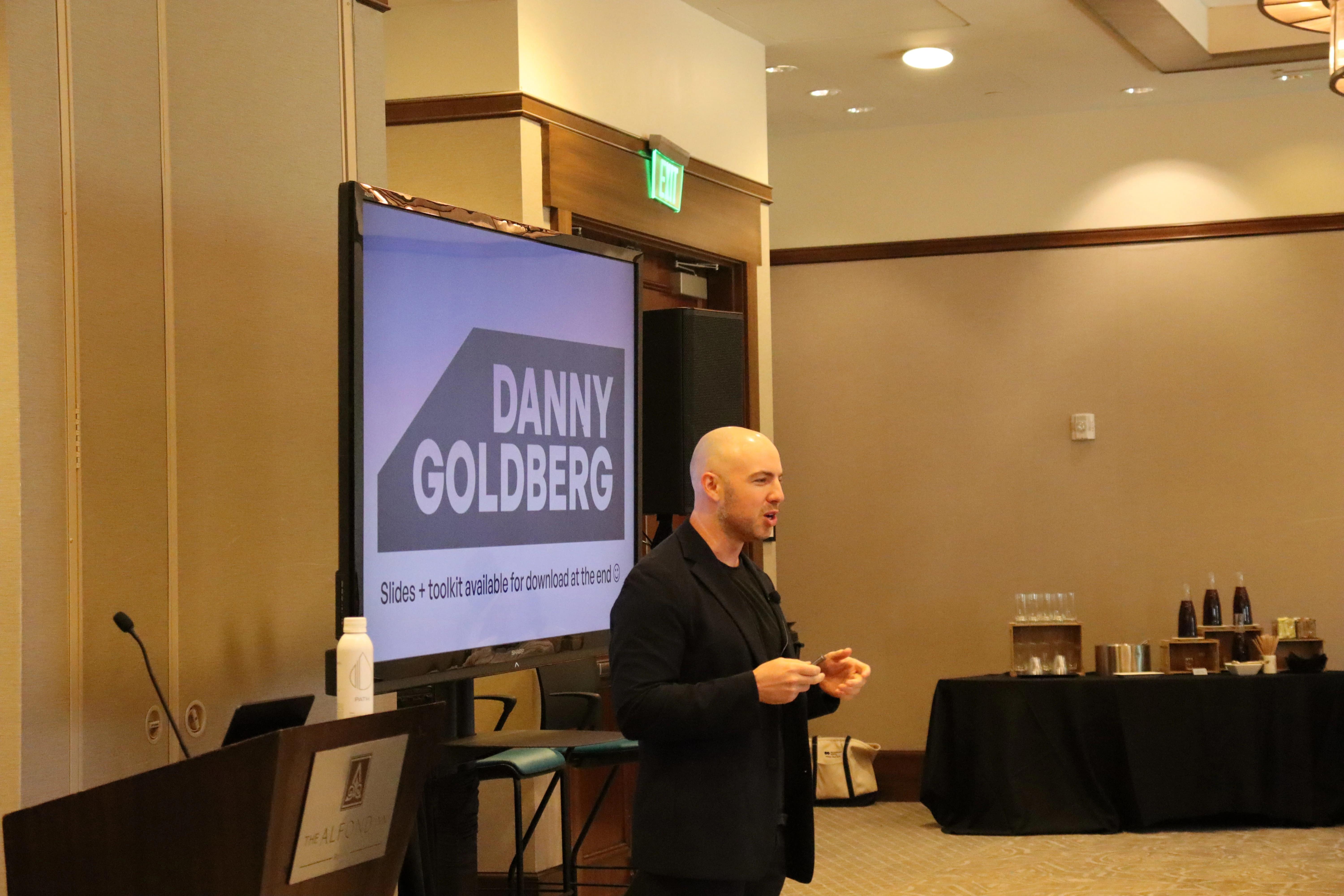 Danny Goldberg speaking to a workshop group in a hotel conference room