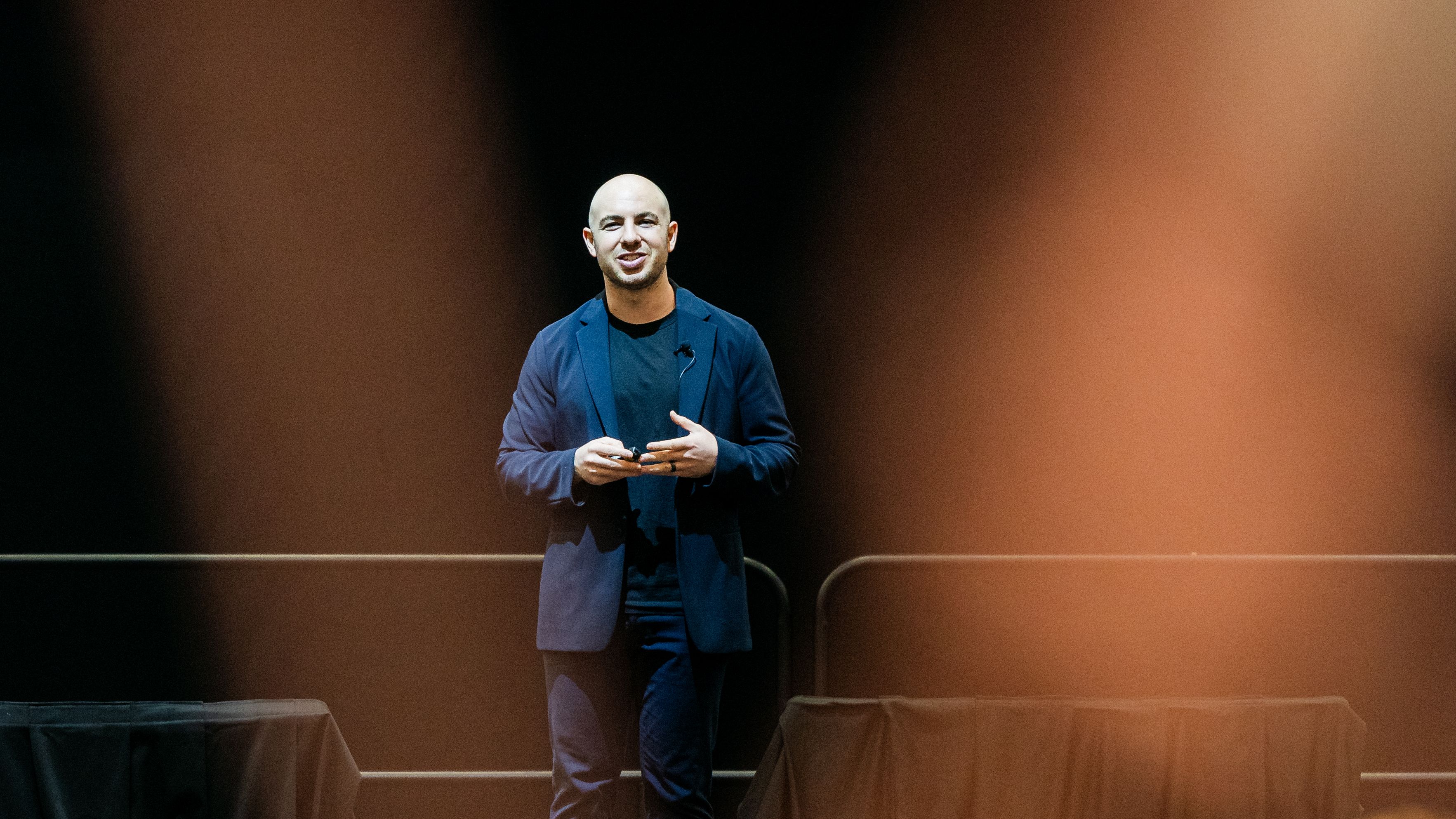 Danny Goldberg speaking on stage at a leadership summit