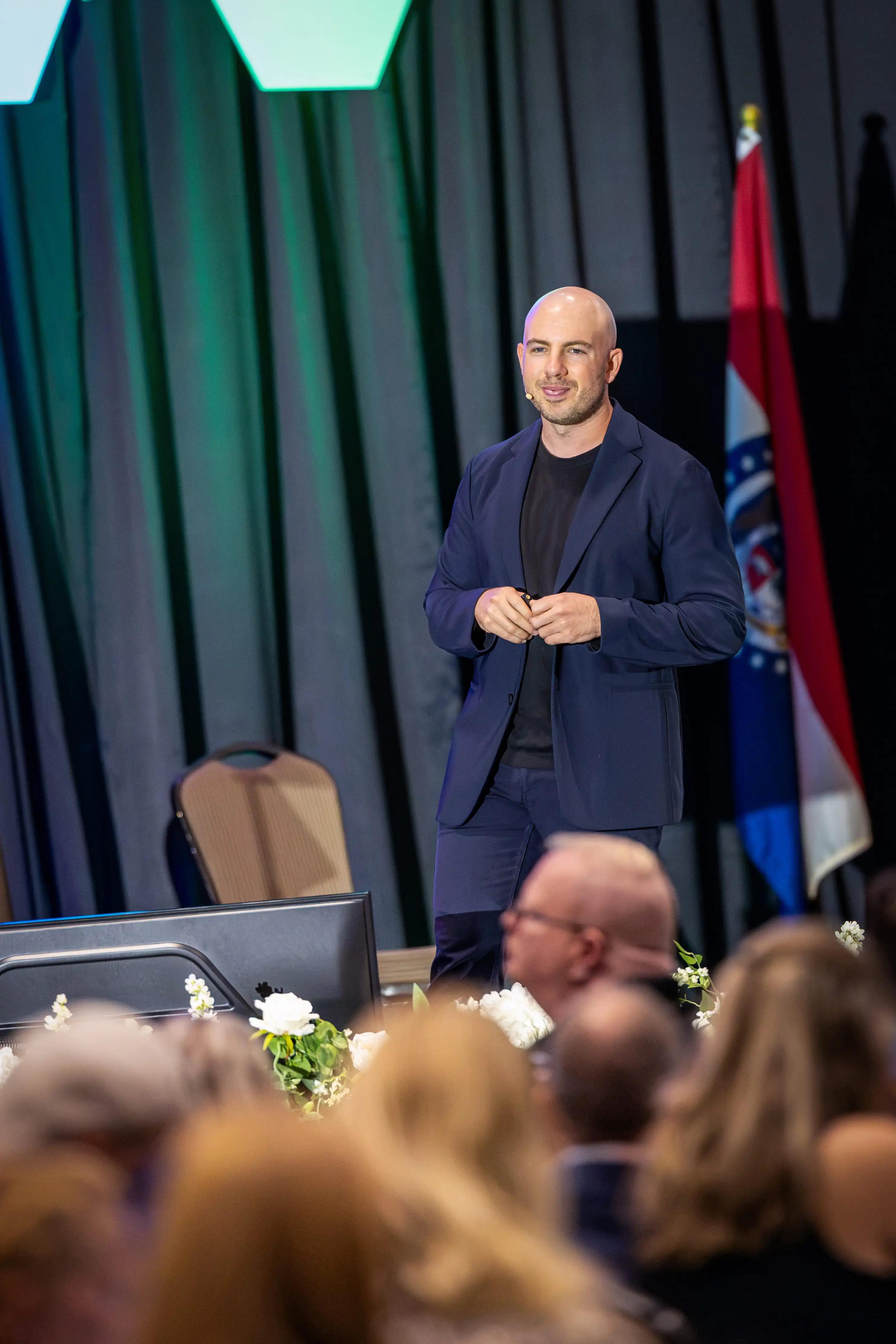 Danny Goldberg presenting to a seated audience at an accounting professionals event
