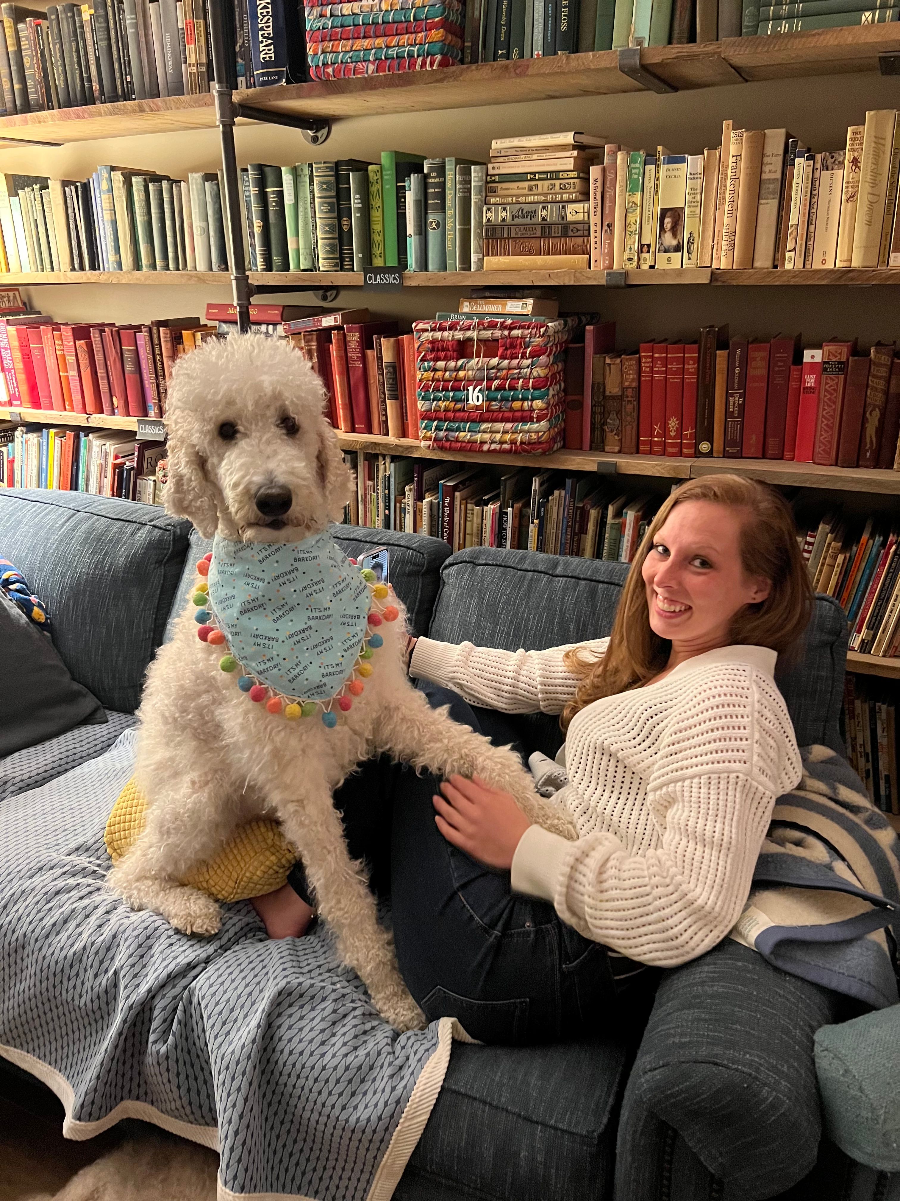 Amanda with a dog in a bookshop