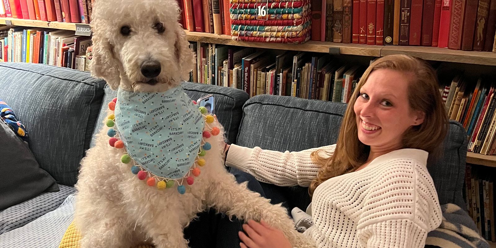 Amanda with a dog in a bookshop