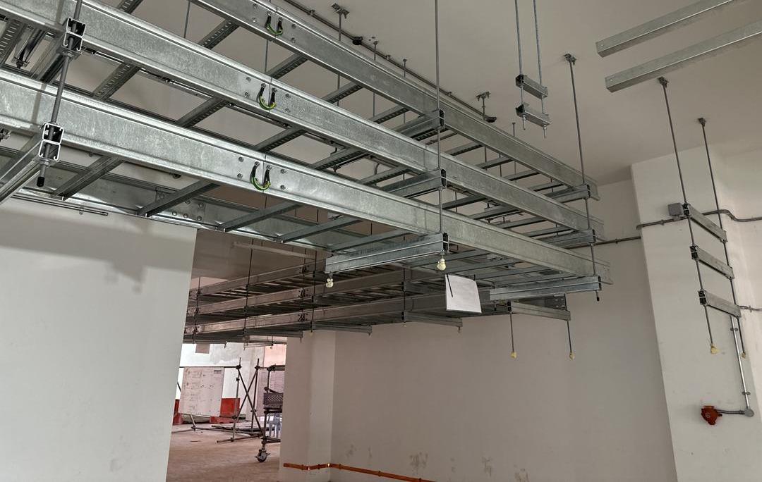 Parallel cable ladder runs with earth bonding across the splice plates