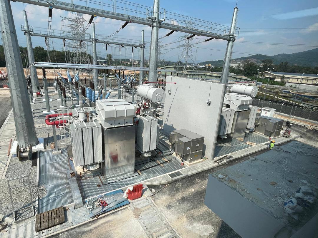 Transformer bay from above, with grating walkways around the transformer and the sunshield in front