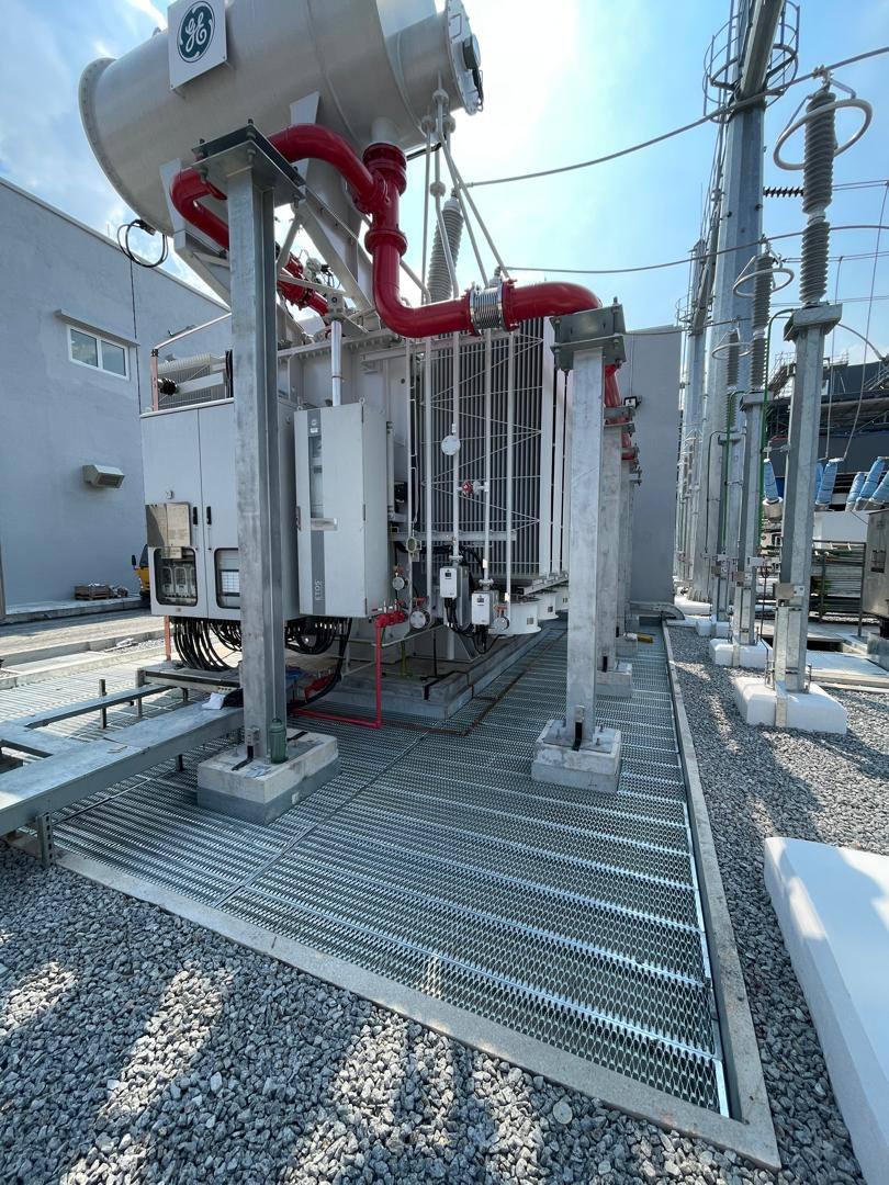 Grating walkway running beside the transformer and its support columns