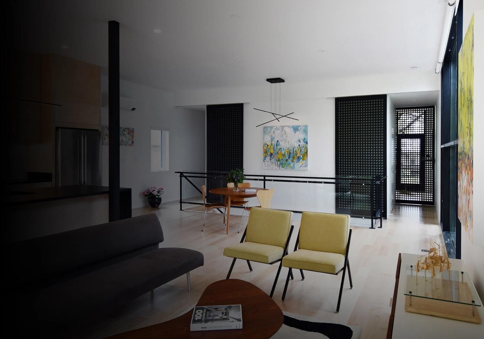 Modern living room with full height cavity slider dividing the living area from the rest of the house