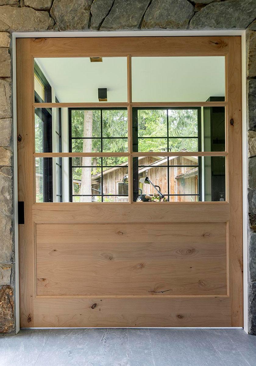 Purity Designs' custom pocket door with 6-lite windows