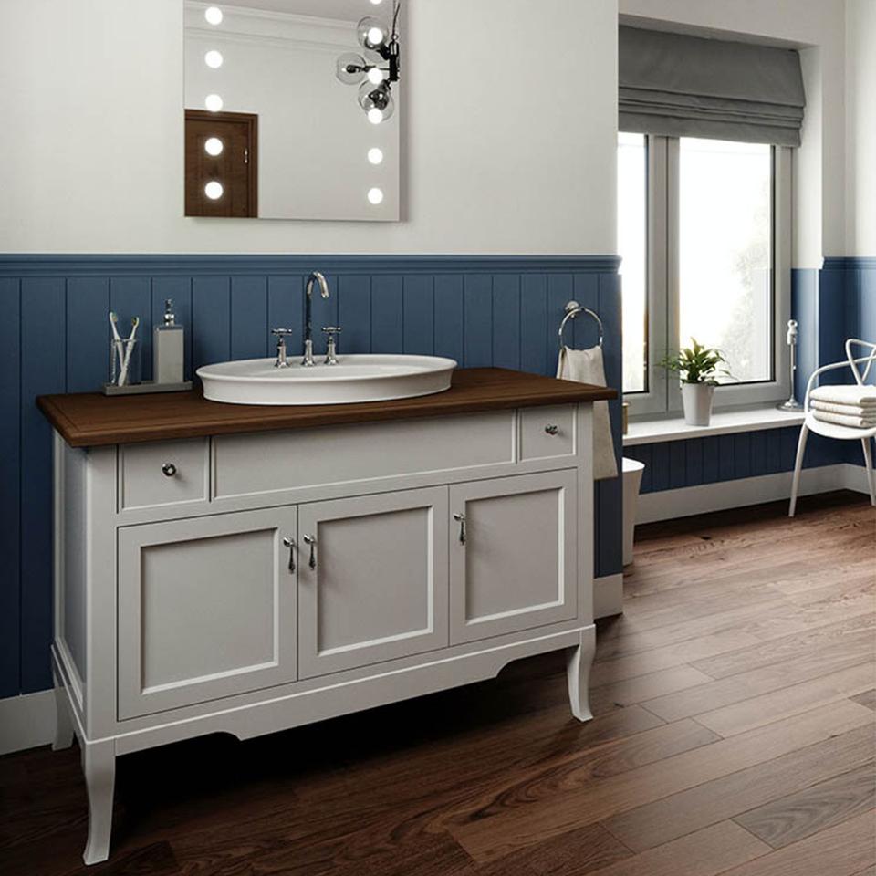 A modern farmhouse bathroom with deep blue shiplap wainscotting