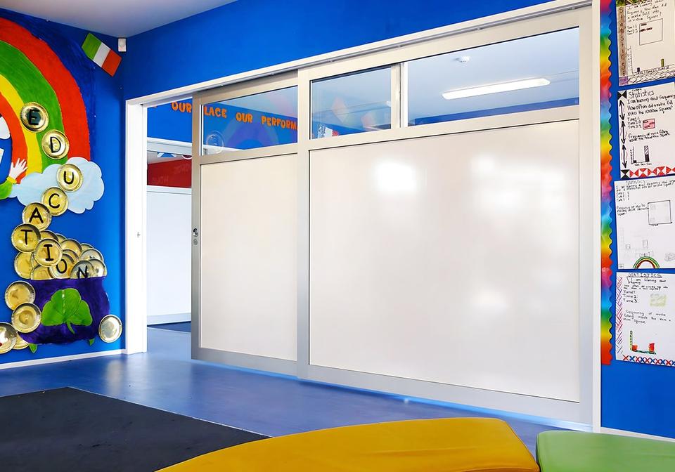 Cavity Slider in a colorful classroom