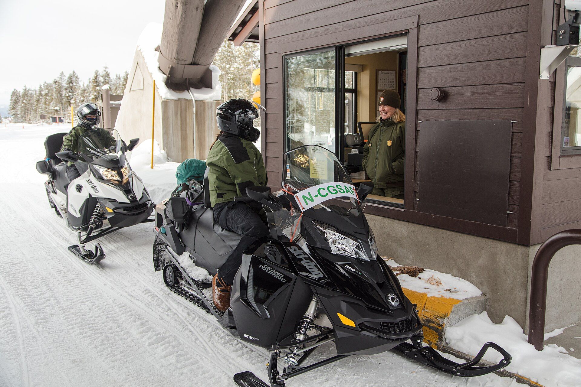 Snowmobiler at the West Yellowstone entrance station