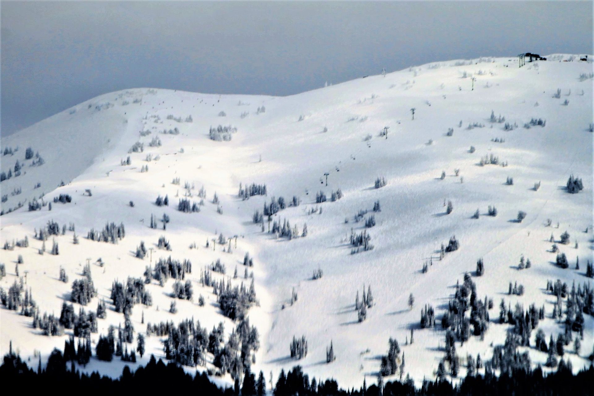 Snow-covered ski runs and lifts at Grand Targhee