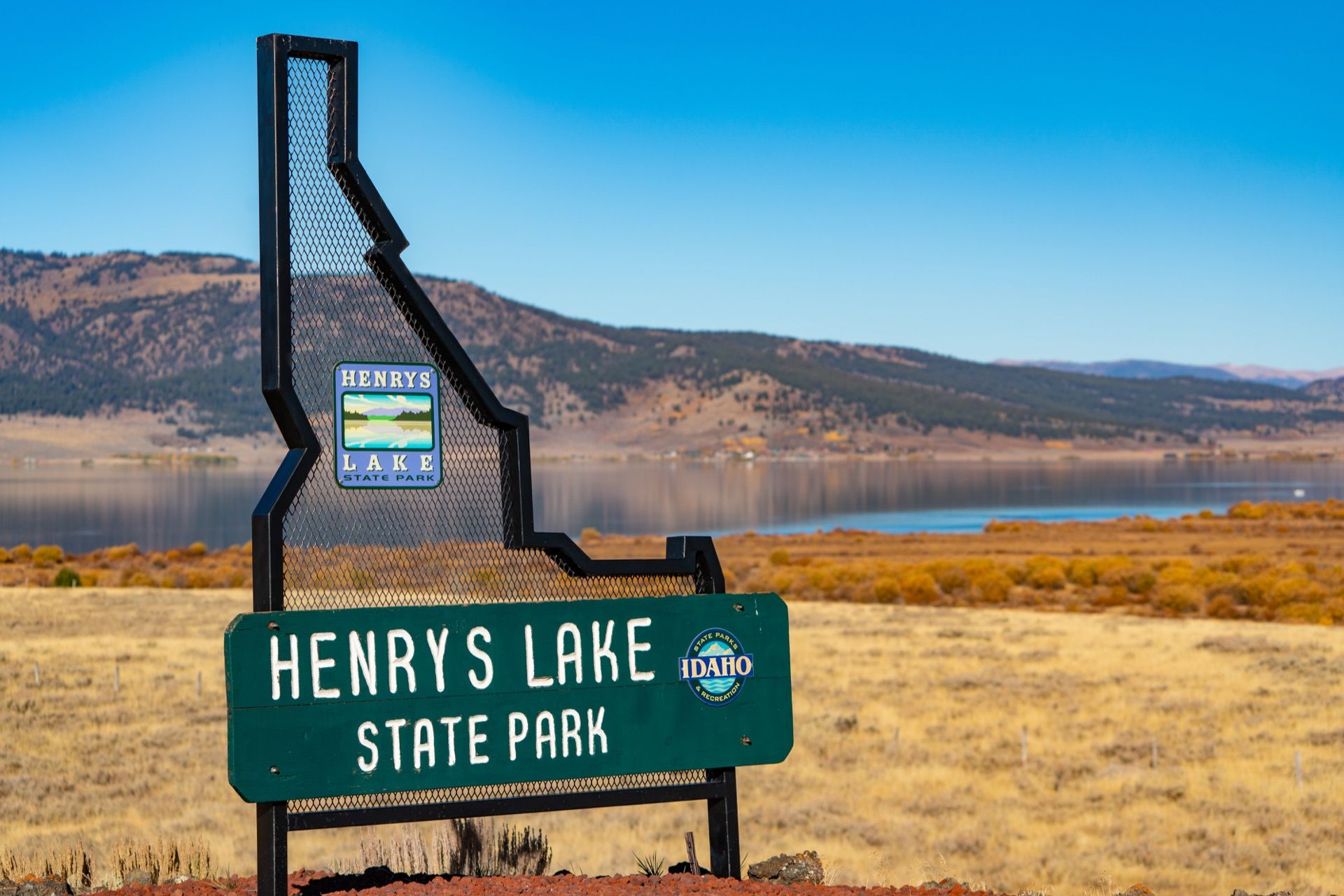 Henrys Lake State Park entrance with lake and mountains