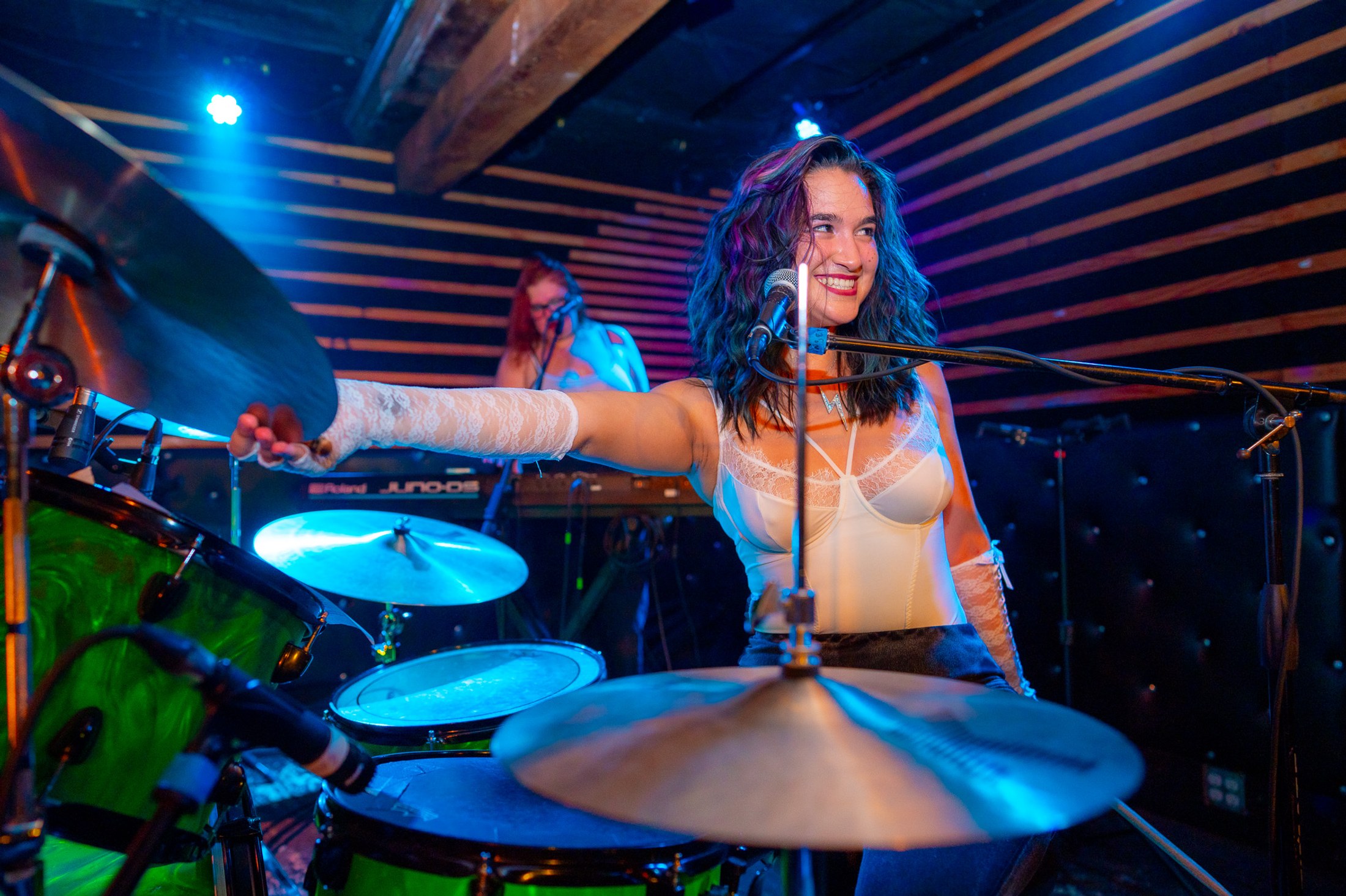 Prismia holding a cymbal
